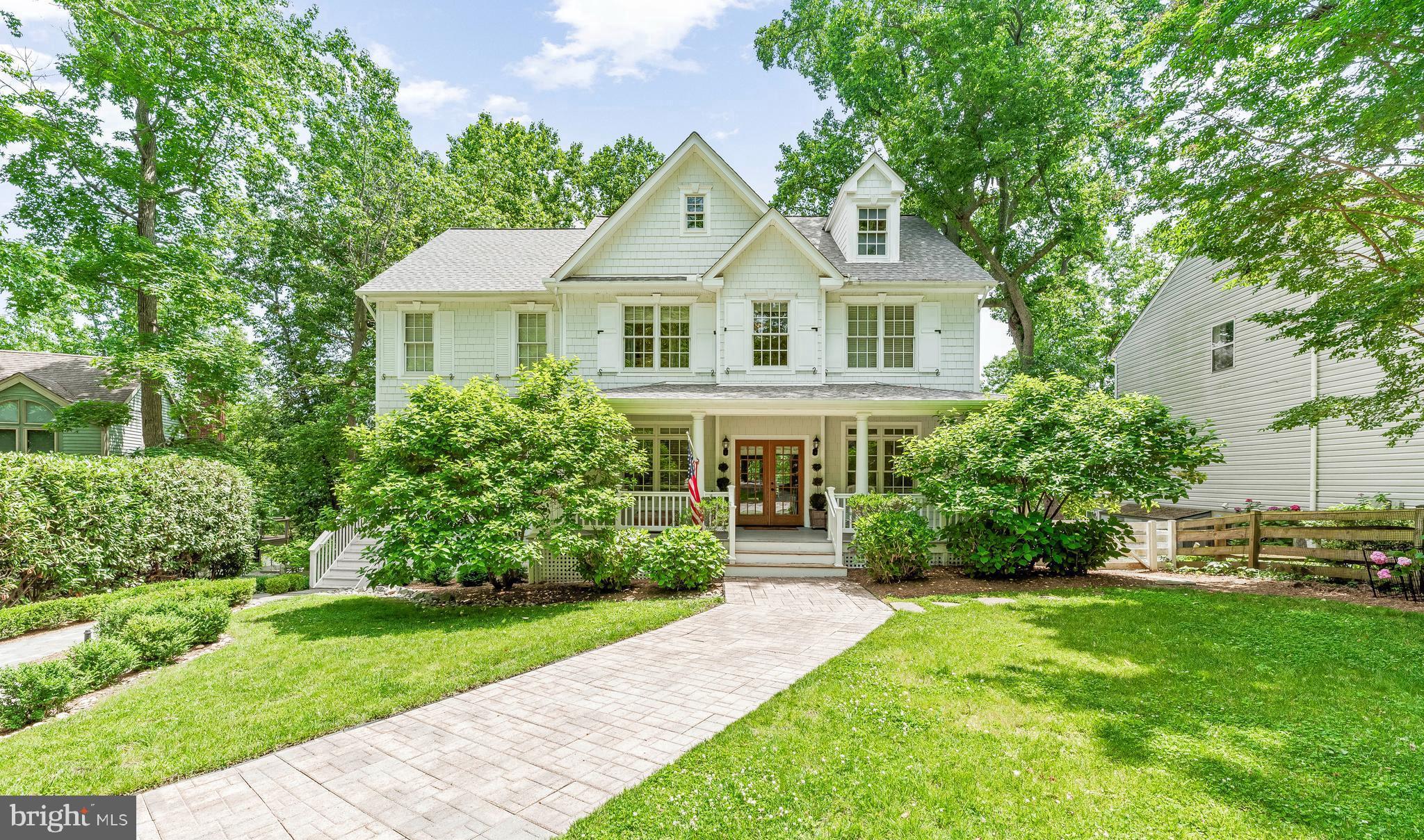 Perched above a quiet cove just minutes from downtown Annapolis, this refined Southern Colonial offers a rare combination of privacy, flexibility, and water views that will never be obstructed. With the Chesapeake Bay Foundation Nature Sanctuary directly across the creek, the setting is defined by light, sky, and uninterrupted natural beauty.\n\n
Graciously scaled living and entertaining spaces open to multiple covered porches and terraced gardens, all oriented toward the water. Inside, natural light fills the home through French doors and oversized windows, while detailed millwork, wide-plank hardwoods, and coffered ceilings create a sense of quiet sophistication. The kitchen is a true chef’s space — outfitted with custom cabinetry, a commercial-grade range, and generous work surfaces for hosting or day-to-day living.\n\n
Beyond the main residence, two fully finished private living quarters are seamlessly integrated into the home’s layout — one tucked on its own wing with separate entry and kitchenette, the other on the walkout level with its own full kitchen, bath, living room, and water-facing porch. Whether used for extended family, guests, or professional hosting, these suites add rare versatility while preserving the elegance of the whole.\n\n
The landscaped half-acre lot leads gently to a private dock and natural shoreline ideal for paddleboarding, kayaking, or simply enjoying the quiet.\n\n
3209 Henson is a property that lives beautifully in all seasons — offering timeless design, flexible spaces, and a lifestyle rooted in privacy, nature, and proximity to the best of Annapolis.