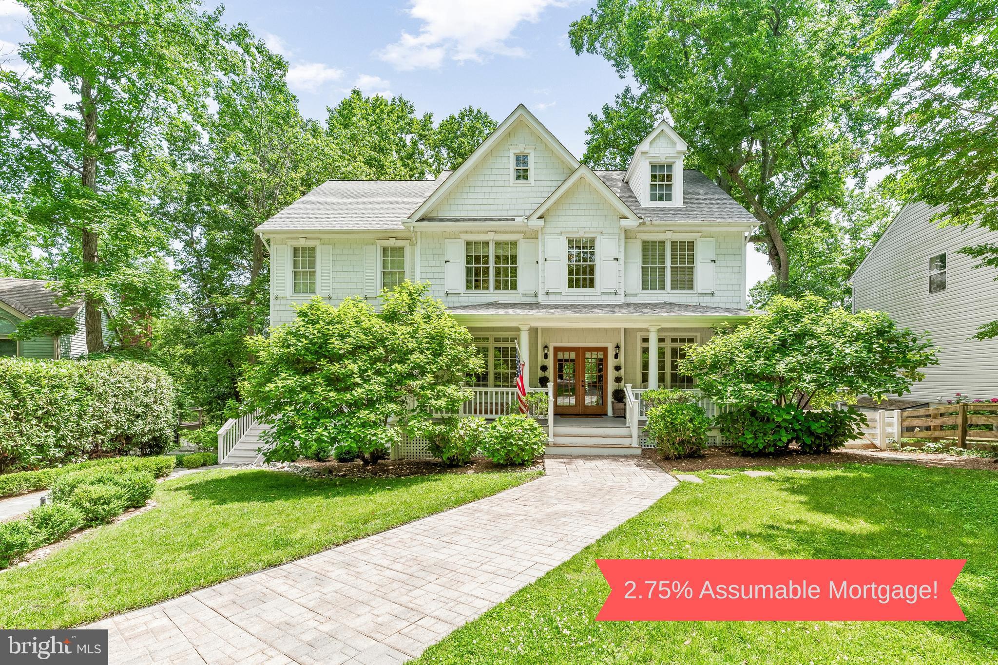 The Seller Has A 2.75% Assumable Mortgage On 865k Potentially Saving >$2,000 Per Month! Perched above a quiet cove just minutes from downtown Annapolis, this refined Southern Colonial offers a rare combination of privacy, flexibility, and water views that will never be obstructed. With the Chesapeake Bay Foundation Nature Sanctuary directly across the creek, the setting is defined by light, sky, and uninterrupted natural beauty.\n\n
Graciously scaled living and entertaining spaces open to multiple covered porches and terraced gardens, all oriented toward the water. Inside, natural light fills the home through French doors and oversized windows, while detailed millwork, wide-plank hardwoods, and coffered ceilings create a sense of quiet sophistication. The kitchen is a true chef’s space — outfitted with custom cabinetry, a commercial-grade range, and generous work surfaces for hosting or day-to-day living.\n\n
Beyond the main residence, two fully finished private living quarters are seamlessly integrated into the home’s layout — one tucked on its own wing with separate entry and kitchenette, the other on the walkout level with its own full kitchen, bath, living room, and water-facing porch. Whether used for extended family, guests, or professional hosting, these suites add rare versatility while preserving the elegance of the whole.\n\n
The landscaped half-acre lot leads gently to a private dock and natural shoreline ideal for paddleboarding, kayaking, or simply enjoying the quiet.\n\n
3209 Henson is a property that lives beautifully in all seasons — offering timeless design, flexible spaces, and a lifestyle rooted in privacy, nature, and proximity to the best of Annapolis.