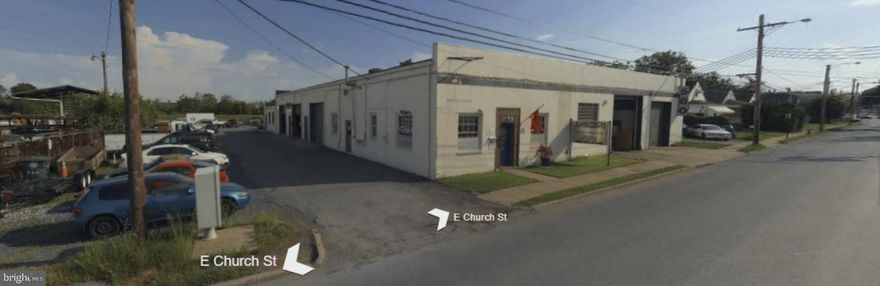 The storage yards are on a land lease. You can purchase the land lease.   
14,380 SF Multi-Tenanted Building on 43,380 SF (0.99) Acres of Land.  The Property contains all Automotive Users in Multiple Suites with Heavy Electric.  Roll Up Bay Doors.  Parking on Three Sides of  Property with Full Drive Around Capability to Access all Suites
  Zoning is LI (Light Industrial).