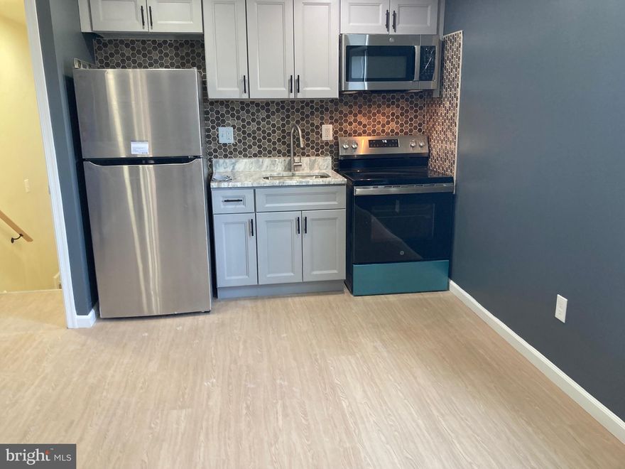 This top-floor, cozy and private, renovated apartment offers new appliances, washer/dryer in apt, an oven/microwave, beautiful countertops, recess lighting, a beautifully tiled bathroom, hardwood floors, unit-controlled A/C and heat, and two freshly painted bedrooms with an open floor plan. No smoking/No vaping! The whole building was renovated in 2024.  No Pets allowed! No Smoking/ Vaping in the newly renovated building.  Tenant pays all utilities & water, and renter insurance. Minimum Lease—12 months. Applicant Requirements: The credit score minimum is 600.  Income requirement 2.5X the monthly rent.  Each person 18 years old and older must complete an online application and background check (fee $50 per person, non-refundable), income verification, and no evictions. Vouchers are welcome and must meet the same qualifications mentioned above. You must complete an online application for pre-screening.