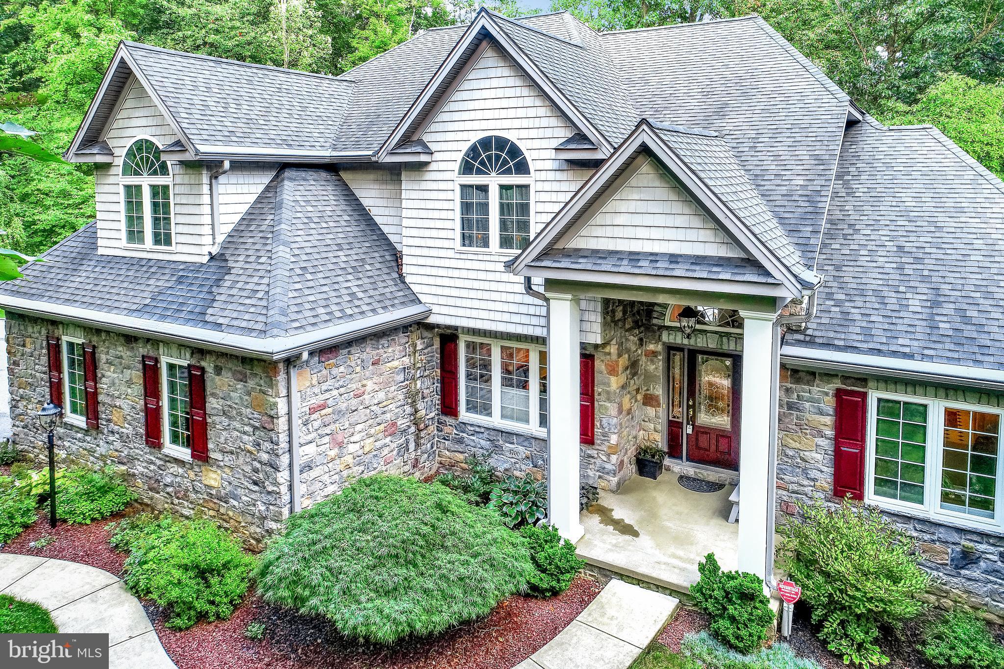 There is so much to say about this beautifully designed custom home offering an open floor plan with a two-story great room, vaulted and tray ceilings accented with custom woodwork. Located next to Rocky Ridge Park and trails making this an exceptional location and perfect for York or Lancaster commuters. Additional features include a semi-wooded lot with numerous areas for relaxing on multiple decks and patio. Upon entering you will be greeted by a curved staircase leading to a loft and 2nd floor master suite and super bath. But wait, if you desire 1st floor living at its finest there is a 2nd master bedroom on the 1st floor with master bath and laundry room just off the gourmet kitchen. Need a place to get away? Enjoy the finished daylight basement with huge family room, den and full bath. Great for a media or game room if you desire.  So much for so little.  Call to schedule a private tour today!                                          What the owner loves about their home:     We built our house to move my Mother in with us, so we have two master suites and wide doorways to accommodate a wheelchair.   We were looking for tranquility and have realized it here the privacy of our deck; a place for hammocks; a separate patio with swing; a pond with stream and a second deck reinforced for a hot tub.     We finished the basement with room for large parties and the it also includes a sauna.     But the best parts are the convenience and location to Route 30 and  I-83, located twenty minutes from Lancaster; forty minutes from Gettysburg; thirty minutes from Harrisburg and one hour from Baltimore.     With all the windows the outside beauty comes inside.  In the living room we are surrounded by trees, which is so beautiful in all seasons, even in the snow.     The perfect house to work from home offering a quiet, peaceful, light and cheerful atmosphere.     We love our house and are only selling it so we can move to a retirement community..