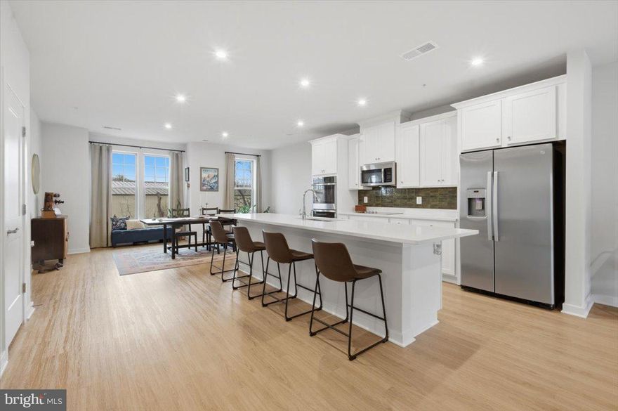 Nearly new Stanley Martin townhome with a one-car garage, ideally located just half a mile from the VRE station, making it a fantastic option for commuters. Built only three years ago, this home offers modern finishes and a thoughtfully designed layout.

The beautiful kitchen features a large island, quartz countertops, double oven, and cooktop, creating the perfect space for both everyday living and entertaining. Just off the main living area, enjoy a private balcony—ideal for morning coffee or evening relaxation.

Upstairs, the spacious primary suite includes a walk-in closet and a comfortable retreat-like feel. Conveniently located within walking distance to restaurants and the public library, this home offers the perfect blend of modern living and an unbeatable location.