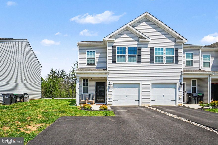 Built in 2024, this end-unit townhome at 1131 Martin Rd offers a modern, low-maintenance lifestyle with thoughtful upgrades throughout. A covered front entry creates a welcoming first impression with an intimate space to relax, while inside, neutral paint and clean lines provide a versatile, move-in ready backdrop.
The open-concept main level is designed for both everyday living and entertaining, with a seamless flow between the living area, dining space, and kitchen. Stainless steel appliances, recessed lighting, and a kitchen bar for additional seating anchor the space, while a 60-inch smart ceiling fan enhances comfort and functionality. Smart switches throughout the kitchen, living room, and front and rear porches offer convenience at your fingertips. A convenient door leads to the backyard, and a well-placed powder room with a timer-controlled vent completes the first floor. Additional upgrades include storm doors at both entrances, a keypad entry from the garage, a smart garage door opener, and an added outlet near the front door.
Upstairs, the primary suite features a spacious walk-in closet and a private ensuite bath with double sinks and a walk-in shower. The closet includes a dedicated 20-amp, 4-gang outlet, offering flexibility for a workspace or additional functionality. The primary bedroom also includes a smart ceiling fan and an added bedside outlet. Two additional bedrooms are positioned at the rear of the home, each with ceiling fans and thoughtful electrical upgrades, including a TV-ready wall mount setup and expanded outlet capacity. The hall bath and primary bath both feature upgraded medicine cabinets with built-in lighting, defrosters, and interior outlets, along with enhanced exhaust systems that include heat and timer functions. A convenient second-floor laundry closet adds to the home’s practical layout. Throughout the home, top-down bottom-up cellular shades provide privacy while maximizing natural light.
Located in Breinigsville within the Lehigh Valley, this home offers easy access to I-78, 222, and 100 for convenient commuting. Nearby, Hamilton Crossings and Trexlertown Plaza provide a wide range of shopping, dining, and everyday conveniences, while Bear Creek Mountain Resort offers year-round recreation just minutes away and Rodale Park is located directly across the street!