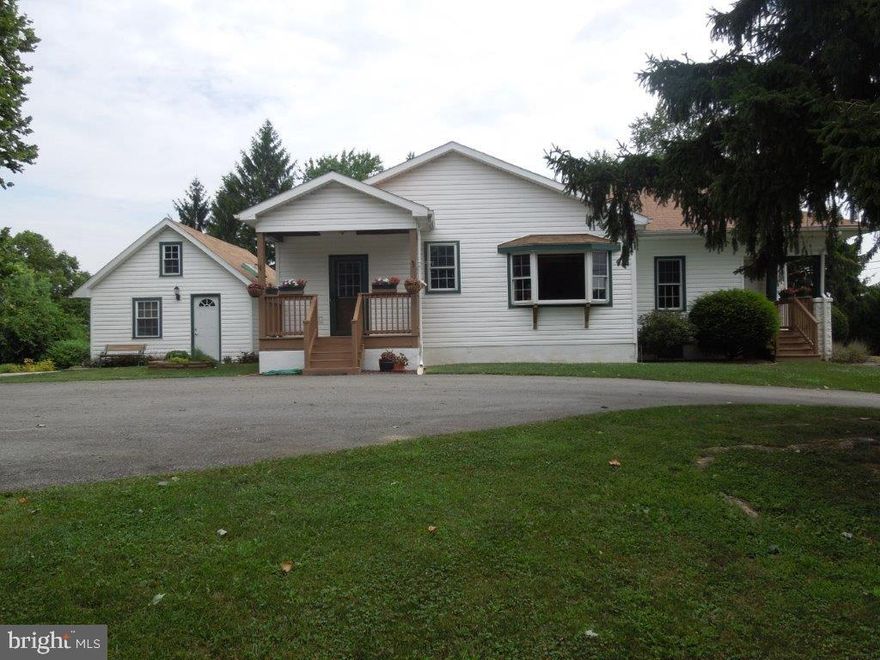Beautifully maintained Sears Craftsman 3-bedroom home built in 1927 with tons of character. Incredible views from every newer replacement window.  1.6 acres bordering approximately 1000 acres of land in the rear and the farmland in the front are all preserved and cannot be developed  . Main house has an open floor plan with 9 ft ceilings and lots of natural light.  Spacious country kitchen with lots of over-sized cabinets. LR/DR combo with large bow window. 3 Bedrooms on the main floor with full bath. Charming cozy Lower Level Family Room with stone walls and wood burning. Huge partially finished attic. Updated plumbing and electrical systems. Bonus   adorable Guest House with loft, full bath kitchenette hardwood floors and wood burning stove. Could be a wonderful studio or office.This wonderful property includes 2 outbuildings. One is an oversized 3 car garage with a carport. The other a storage shed for gardening equipment. Lovely yard with 10 fruit trees, stamped patio and vegetable garden Great location. Super quiet and private but minutes from route 30 and 462. Move in ready!