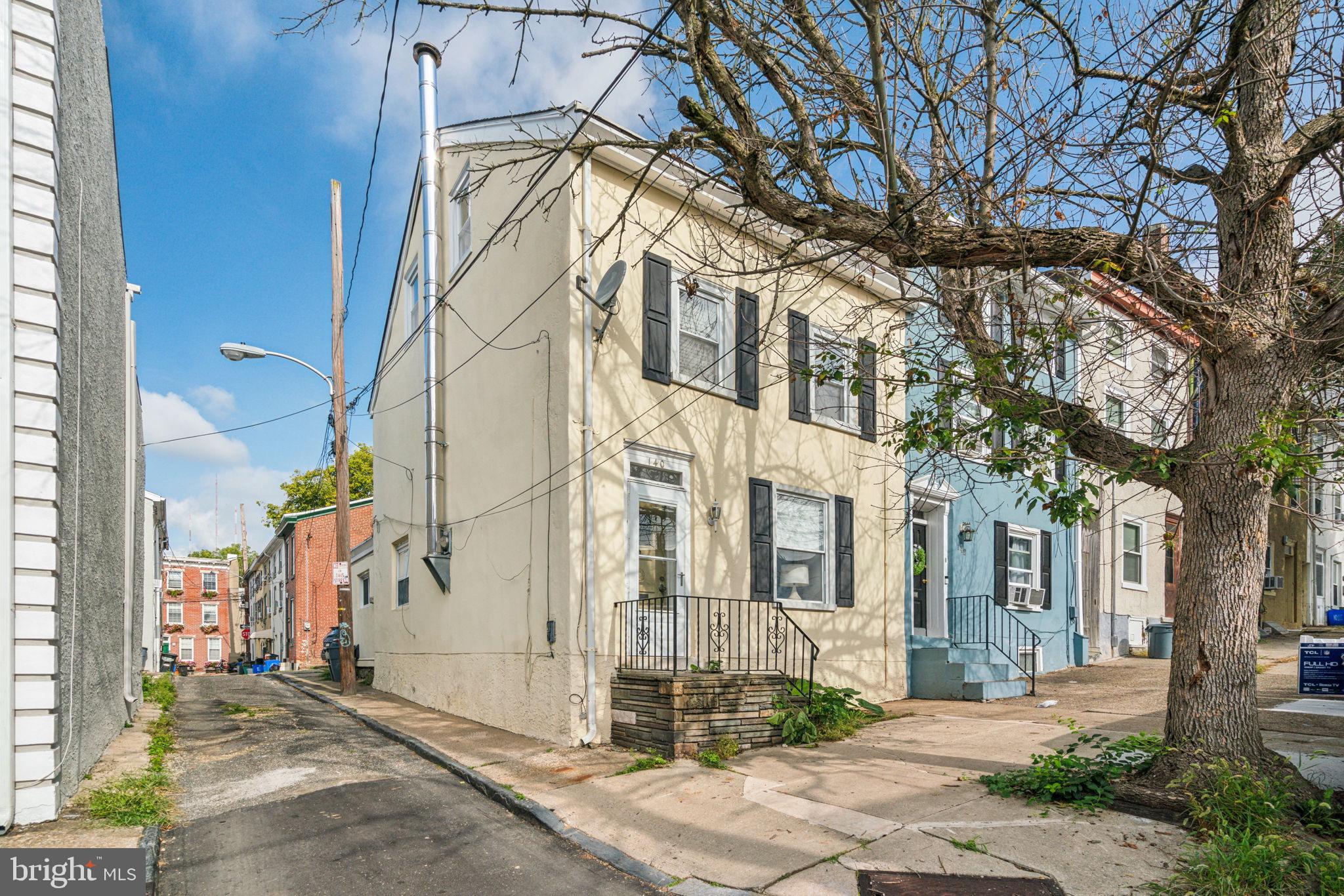 Come see this End of three story row with deep lot size …original hardwood floors on the main floor, exposed stone in the living room, dining room, and adorable kitchen!! The second floor has 2 bedrooms plus one bathroom and the third floor is the entire primary suite with exposed beams.