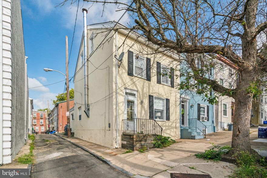 Come see this End of three story row with deep lot size …original hardwood floors on the main floor, exposed stone in the living room, dining room, and adorable kitchen!! The second floor has 2 bedrooms plus one bathroom and the third floor is the entire primary suite with exposed beams.