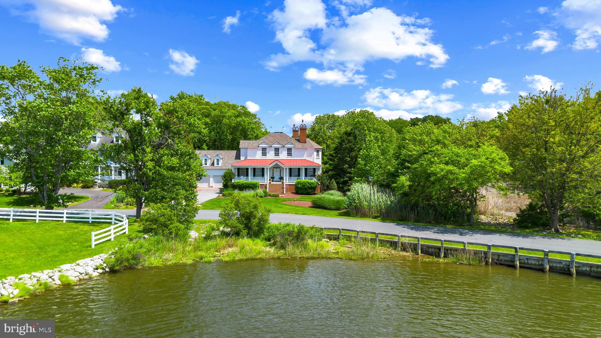 Exquisite Savannah Style custom-built home in sought after, amenities-rich, Fishing Creek Farm community in Annapolis. This non-riparian waterfront home is nestled between 2 bodies of water providing endless water views from almost every room of the house. Wake up early to watch the wildlife and the sunrise over Cherry Tree Cove from the rear screened porch or enjoy peaceful water views and sunsets over Duvall Creek from the relaxing front porch. Upon entering the home the generous Foyer opens onto the formal Living Room with fireplace and custom built-ins and the spacious Dining Room which flows into the beautiful Gourmet Kitchen filled with high-end appliances and charm. The adjacent spacious Family Room and expansive 3 seasons porch overlooking the lush backyard and sparkling water of Cherry Tree Cove are perfect for entertaining. With 5 bedrooms and 5.5 baths including a private and conveniently located guest suite above the garage, there is plenty of space for a large family and the many guests that are sure to come visit in this stunning setting. The fully finished basement boasts an additional living space, game room, play area, full bath and wet bar. The free-standing Office/Studio area provides endless possibilities. The sought after community of Fishing Creek Farm offers a community pool, tennis courts, marina, beach and much more, all just a quick stroll from this amazing property. Located just minutes from downtown Annapolis and Eastport which offer the perfect balance of small-town charm and big world sophistication. Traveling or commuting is just as convenient by easily accessing Rt. 50 and 97 which provides direct access to Baltimore, BWI, Ft. Meade/NSA and Washington, DC., or head over the Bay Bridge to the Eastern Shore for a quick beach vacation. Welcome Home!
