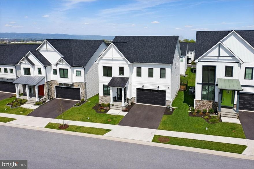 Welcome to luxury living in the heart of Frederick County.  8776 Walnut Bottom Ln is a 6 bedroom 5 full bath home loaded with upgrades and high end finishes.  As you enter the foyer there is a full bath, thoughtfully tucked away. The foyer leads to a beautiful office space which could be used as a main level bedroom. The kitchen features stainless steel appliances, an oversized island with upgraded counter tops and tons of room for seating plus, a large walk-in pantry.  Large windows let in tons of natural light in the living and dining space.  The open concept is perfect for entertaining and everyday living. As you go upstairs you will find 4 spacious bedrooms with walk-in closets, 3 full bathrooms.  An upstairs laundry room is conveniently located near the bedrooms along with a loft space that is perfect for a play area, reading nook or just a nice spot to unwind. The large primary bedroom features two walk-in closets and luxury spa bath complete with double vanities and a sizable shower. The basement area is versatile and an entertainers dream with tons of space and has a bar with sink and mini fridge, a large entertaining area, full bathroom and a bedroom with walk-in closet. Conveniently located near commuter routes, stores, restaurants and minutes from Downtown Frederick. No city taxes!  Book your tour today!