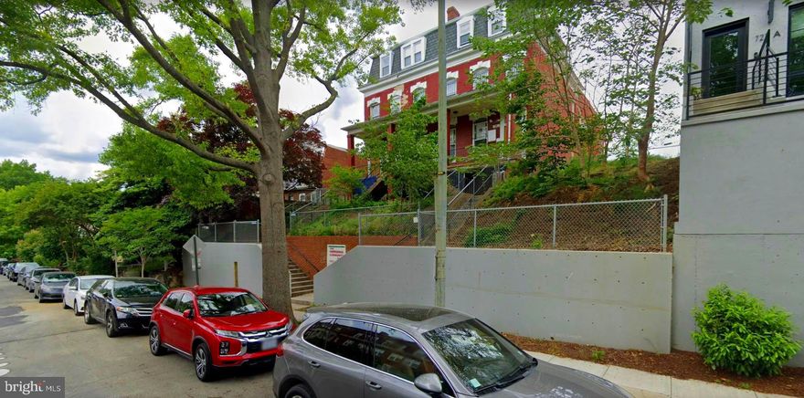 Rare development opportunity in Columbia Heights!  Introducing an approximately 8,400 sf building on an 11,400-sf lot situated approximately 2 stories above the street level for spectacular city scape views and priced for re-development.  This distinctive Victorian Colonial building most recently housed the non-profit, Emergency Community Arts Collective (ECAC) and has a stately south facing façade with a covered front porch and embodies all the charm and elegance of a bygone era. The parking lot area accessible via the alley between Fairmont and Euclid Streets NW has been paved with semi-permeable pavers and added green features include solar panels and a 200+ gallon rainwater reclamation barrel.  Part of the side yards are usable for vegetation and there is a tiered front yard with bifurcated concrete stairs meeting at the lower street level landing and top landing of the covered front porch. Convenient to restaurants (Georgia Ave, 11th Street & U Street corridors), grocery stores (Whole Foods, Giant, Safeway & Trader Joes) coffee shops (Coffee Roasters, Starbucks), gyms (Washington Sports Clubs & YMCA) with a 93-walk score and 92 bike score. Please contact the listers to schedule an agent accompanied walk-through.

History of 731-733 Euclid St NW building: Estimated to have been built in the late 1800s, the original property was four small three story row houses on an 11,400 square foot lot. Over time, the two houses on either side were torn down. The two remaining houses were combined into one and a large two-story addition was added in 1930 when the building opened as the Meriwether Home for Destitute Children. What stands today is a large two-story building with a smaller third story and basement.