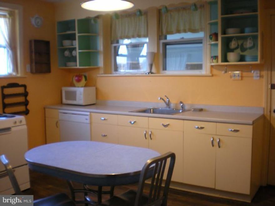 Completely restored circa 1847 charming and updated rowhome tucked away on quiet street in a disignated historic district and in walking distance to the town of Phoenixville.  Lovingly restored by the artist owner and her historical contractor partner.  The home includes hardwood floors throughout, deep window sills, detailed carvings and living room with mantle piece. There is also an EIK, and an enclosed porch that leads to a small fenced in yard with garden area. All appliances and furnace are only 9 1/2 years old. Washer/Dryer in the full sized walk-out basement. 2nd floor has 1 bedroom, walk-in closet, sunny bathroom with vintage furnishings, new tile shower surround and all modern fixtures. There is also a third floor finished loft. Railing to be installed going to 3rd floor. Private parking for 2 cars plus! Park your car for the weekend and walk to restaurants, movie theater, farmer market, coffee house and boutique shopping!