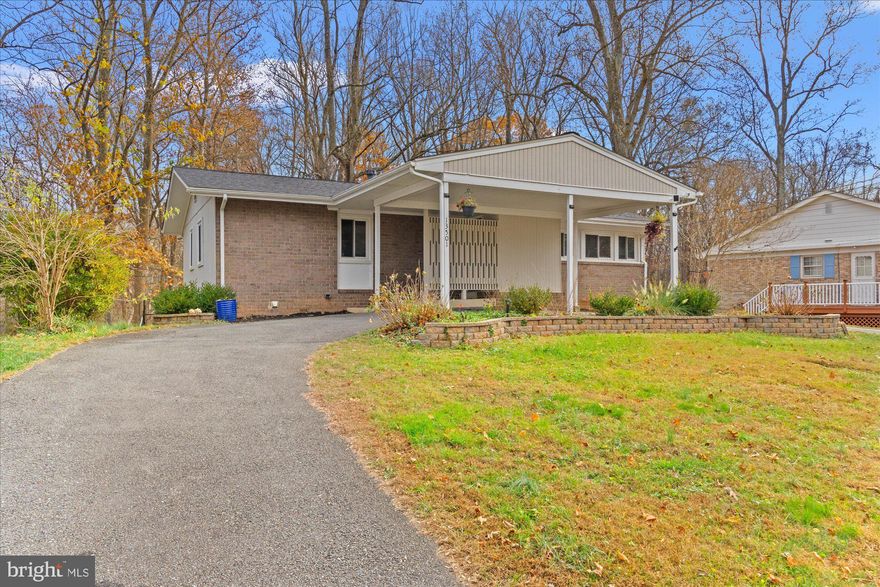 Discover this updated mid-century modern home featuring a bright, open floor plan with hardwood floors throughout the main level. The stylish chef’s kitchen offers a large center island, ideal for everyday living, entertaining, and modern convenience.  The main level includes 3 bedrooms and 2 renovated full bathrooms, while the walkout lower level adds a spacious den, 2 additional bedrooms, and a third updated full bath—making this a 5-bedroom, 3-bath home perfect for flexible living.  Step outside to a large private deck overlooking peaceful, tree-lined views and direct access to Paint Branch Park, complete with scenic walking and biking trails. This serene outdoor setting is perfect for relaxing, hosting guests, or enjoying productive work-from-home days.   Property updates include: roof (2021), HVAC (2021), chimney liner (2021), front yard retaining walls (2022), deck (2023), basement remodel (2025), and water heater (2025)