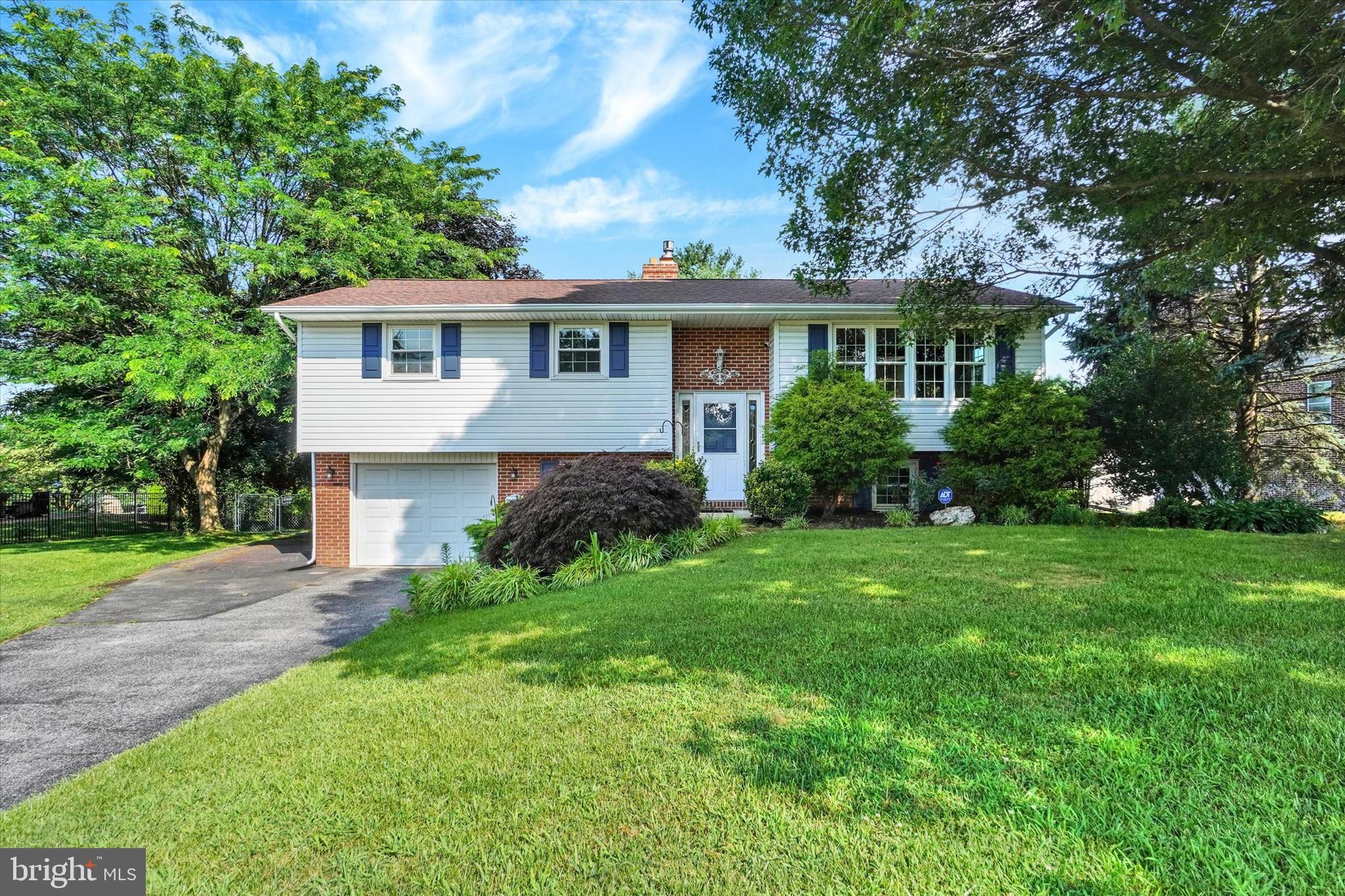 Step into charm and comfort with this adorable 3-bedroom, 2.5-bath home, perfectly situated on a beautifully manicured lawn surrounded by mature trees, vibrant gardens, and flowering shrubs. The fully fenced backyard is an entertainer’s dream—featuring a covered patio, multiple decks, and even a shed with electric, ideal for hobbies or extra storage. Inside, you'll find numerous updates throughout, including newer windows, a newer furnace, and stylish new vanities in all bathrooms. The spacious kitchen comes complete with all appliances, making this home truly move-in ready. The finished walk-out basement offers a cozy retreat with a gas fireplace—perfect for movie nights or gatherings with friends. Extend your entertaining outside to the paver patio or one of the decks! This home checks all the boxes with its blend of indoor comfort and outdoor beauty. Don’t miss your chance to own this private oasis!