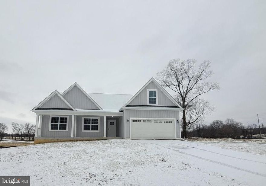 Cambridge model with full front porch with February/March 2024 deliver.  This model features 4 bedrooms &  3 full baths. Full basement, stainless steel kitchen appliances, granite, luxury vinyl plank flooring, carpet, and more. Ideal setting, close to amenities. Shown with optional wainscotting and gas fireplace. Experience quality and value with this builders finished product. Great commuter location. Photos are similar construction with upgrades. Your 5 + acre lot allows horses, chickens and more. Just off the Virginia state line. This is the last 5 acre parcel available.