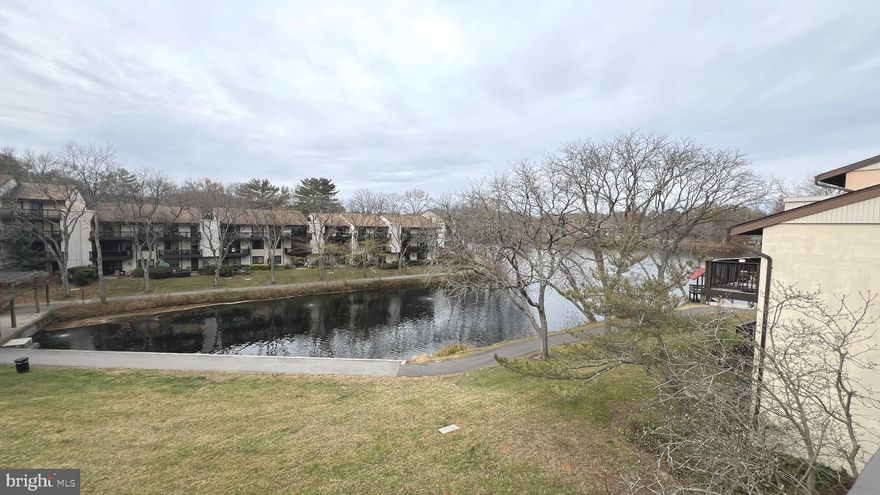 **Just reduced** Welcome home to this beautifully refreshed, top-floor, 2-bedroom/2-bathroom  condo overlooking Wilde Lake in Columbia, MD, offering a design that is both warm and inviting. This unit provides a modern feel with sought-after features like new flooring throughout and a refreshed kitchen counter/bar, perfect for quick move-in. The open concept living room/dining room combination is ideal for gathering and entertaining, leading directly out to a two-door private balcony that offers stunning, peaceful views overlooking Wilde Lake. Offering style, function, and convenience, this condo is located in the highly desirable Cove/Village at Wilde Lake community, close to the Columbia Mall and major commuter routes. Schedule your showing today!