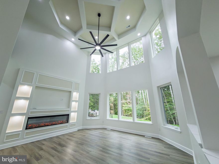 Absolutely Stunning Brand-New Modern Colonial!
<br>
Discover the perfect blend of modern luxury and timeless elegance in this custom-built masterpiece, showcasing three levels of refined living with 5 spacious bedrooms, 5 full bathrooms, and nearly 6,500 sq. ft. of beautifully finished space — ideally located in the highly sought-after Laurel Ridge Subdivision.
<br><br>
From the moment you enter the grand double-staircase foyer, the craftsmanship and attention to detail are undeniable. Soaring ceilings, gleaming floors, and designer light fixtures set a sophisticated tone, while the open layout seamlessly combines comfort and style in every room.
<br><br>
Built with precision and care, this home reflects a commitment to uncompromising quality — where no corners were cut and only premium materials were used. Every element, from the foundation to the final finishes, was thoughtfully designed for durability, elegance, and lasting beauty. This is not a home built for speed or savings — it’s a home built for excellence.
<br><br>
The two-story family room serves as the centerpiece, featuring a striking modern ceiling fan, custom lighting, and an elegant fireplace that adds both warmth and character. The chef’s kitchen is truly a showpiece — highlighted by a circular tray ceiling, stainless steel appliances, premium granite countertops, custom cabinetry, a massive center island, and built-in accent lighting that blends form and function. From the kitchen, step through the sliding glass doors to enjoy a serene, private view of the trees.
<br><br>
Throughout the home, exquisite millwork — including crown molding, chair rail, modern octagonal coffered ceilings, and shadow boxing — elevates the design. Recessed lighting, chandeliers, and decorative sconces complete the home’s refined ambiance. Upstairs, each bedroom offers generous closet space and contemporary fixtures, creating a perfect balance of comfort and sophistication.
<br><br>
The fully finished lower level expands the living space even further — ideal for a home theater, gym, or recreation area — with direct walk-up access to the backyard.
<br><br>
Step outside to your private outdoor retreat, designed for both entertaining and quiet relaxation. Additional features include a two-car garage, ample storage, and access to community amenities such as golf, pools, tennis courts, walking trails, and playgrounds.
<br><br>
Perfectly located just minutes from the new VA Hospital, Spotsylvania Hospital, I-95, VRE, shopping, dining, and the University of Mary Washington — this home offers an exceptional blend of elegance, comfort, and convenience.
<br><br>
Every detail has been executed with integrity, care, and craftsmanship — making this one-of-a-kind residence a true definition of modern luxury living.