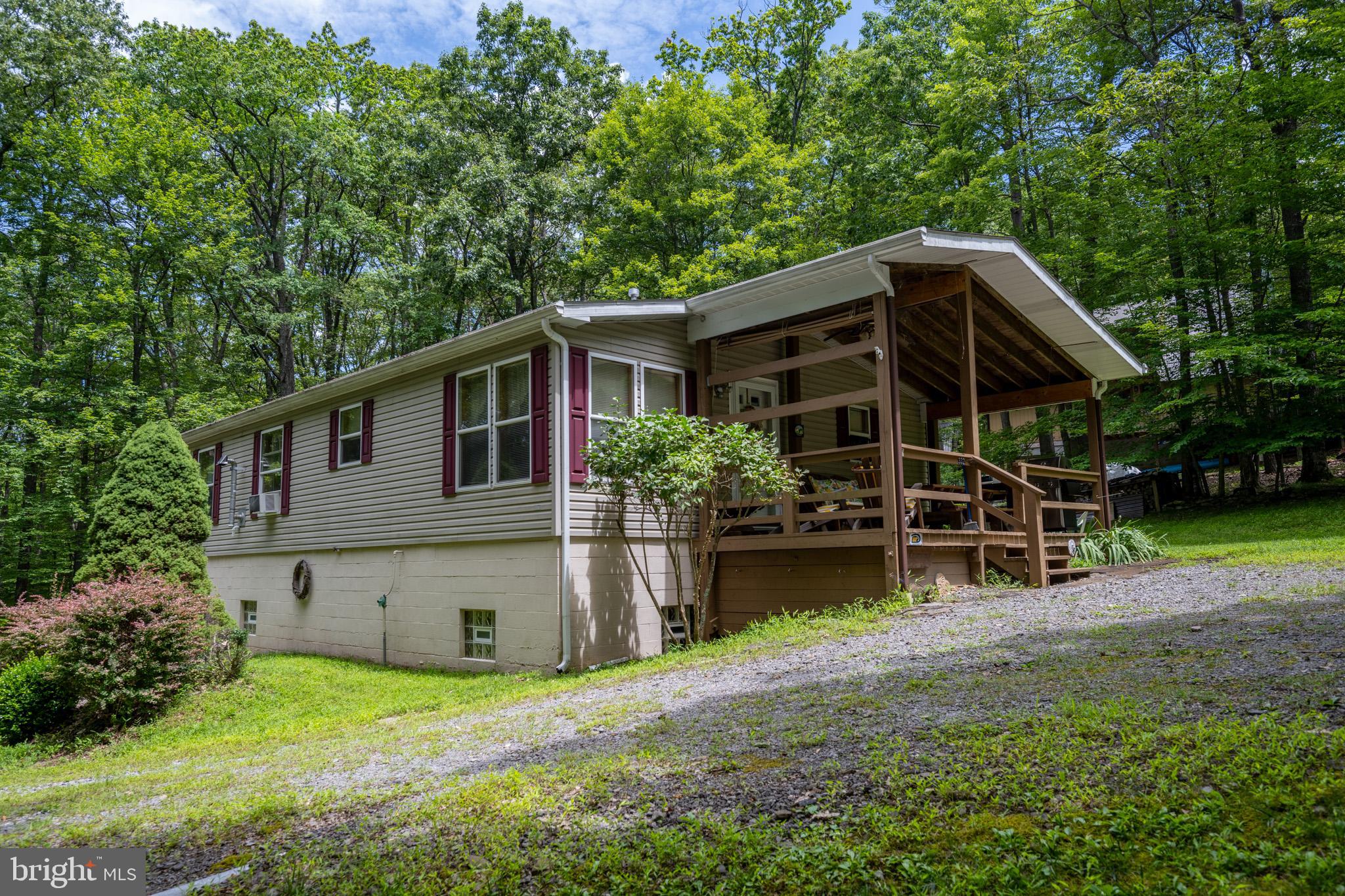Three bedroom/two bathroom lake access home that sits on 1.25 acres in the heart of Sky Valley. A full, unfinished basement/garage has plenty of room to park a boat and golf cart, with lots of room left over for storage. In addition to the three bedrooms, there is a nice sized kitchen, dining area and living room. The Sky Valley community offers a roped off swimming area, a fishing pond, and there are dock slips available through the HOA.