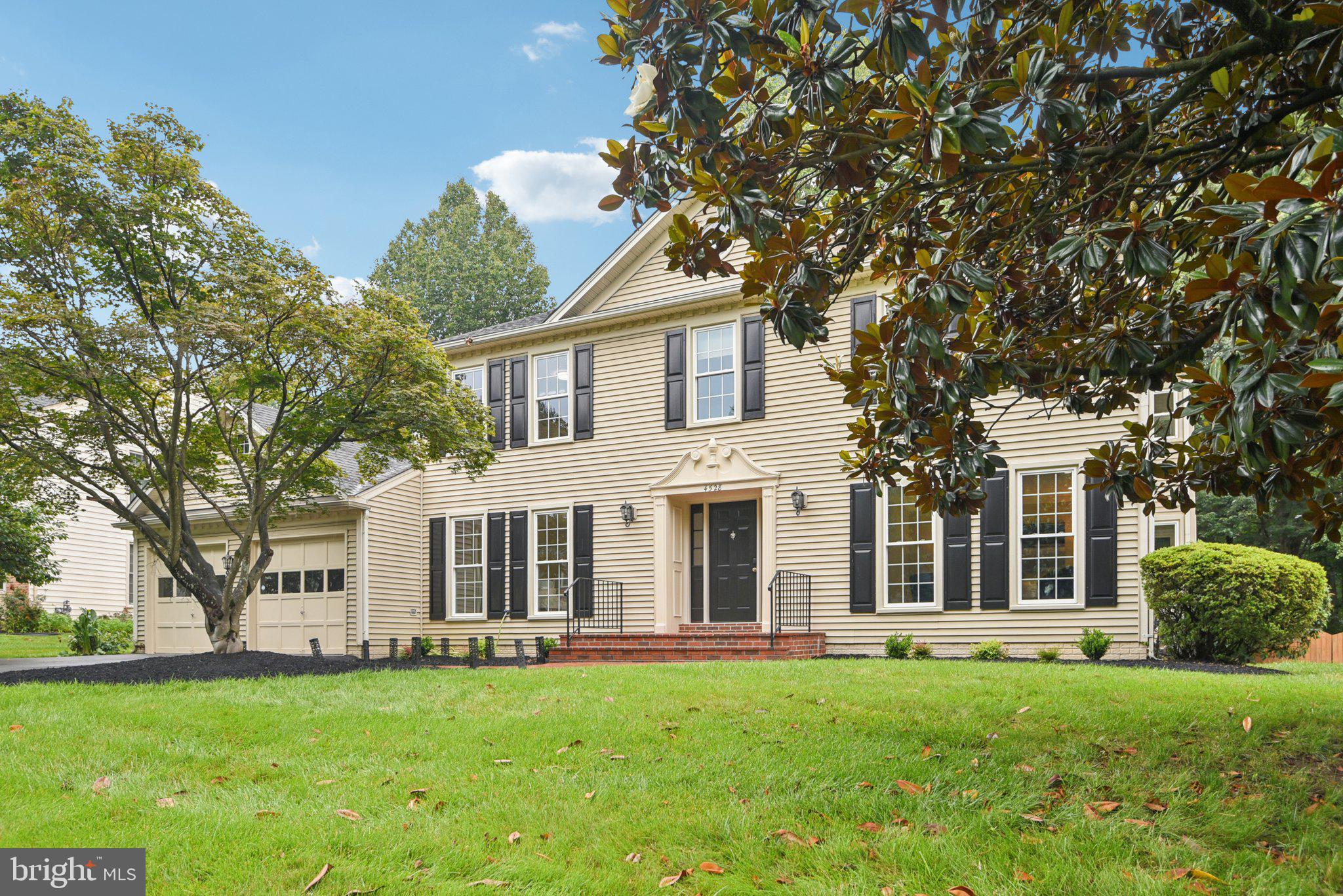 Welcome to this exceptional 4-bedroom, 4.5-bathroom home offering over 5,000 square feet of living space, ideally located in the sought-after Sutton Oaks community. The main level greets you with a grand two-story foyer with Brazilian cherry hardwood floors (2022) that run front to back. A sun-filled living room and formal dining room flank the entry, while the heart of the home—the chef’s kitchen, updated in 2022—features granite counters, double wall oven, a five-burner island cooktop, Zephyr 700 CFM hood, and an entire stainless suite. The kitchen’s open sightline to the family room and seamless walkout to a three-season room and large deck make everyday meals and weekend gatherings great for entertaining.
Upstairs, retreat to the expansive primary suite, featuring a walk-in closet and a luxurious ensuite bath with a double quartz vanity, jacuzzi tub and separate shower. Three additional generously sized bedrooms, two full baths with quartz vanities and newer carpet complete the upper level. A finished lower level offers more space to relax, brightened by LED recessed lighting throughout, with space flexible for a family media lounge, kids playroom, home gym, or office, wet bar and includes a large dedicated storage room—whatever best suits your lifestyle.
Major systems are already handled: a 50-year architectural-shingle roof (2022), dual high-efficiency HVAC units (2021 and 2023) with smart thermostats, an 80-gallon gas water heater (2023) and a Level-2 EV wall charger in the garage. Water quality is enhanced by a whole-house softener plus a six-stage reverse-osmosis purifier. Commuters can reach Routes 50 and 28, Fairfax County Parkway, Dulles International Airport, with plenty of shopping including Wegmans, Costco, and Target just minutes away.