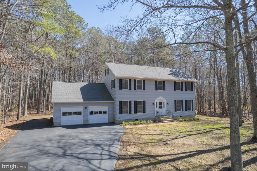 Just over 3,000 sq.ft.  5-bedroom 3 full bath home sits on 1.37 acres on a beautifully tree lined lot. The home has a renovated kitchen with quartz countertops and tile backsplash. LVP flooring throughout the main level, as well as throughout the second story. On the main level you will find a large family room, four seasons sunroom, that walks out onto your two-story deck, dining area and large beautifully renovated kitchen.  There is a proper mudroom coming in from the garage that has ample storage for all of your gear.  A large primary bedroom with an updated ensuite, as well as laundry located on this level.  Moving upstairs you will find 4 bedrooms. The second primary bedroom features an updated ensuite bath, and a large walk-in closet.  In the hallway there is a large 4-piece bath, that has also been updated that will service the other 3 large bedrooms.  Additionally, you will find a walk-out to the second story deck which overlooks your private wooded back yard.  The home features a large attached two car garage, with a separate storage area in the back, perfect for either additional storage or a workshop. This home is conveniently located just minutes from the Grocery Store, Hardware Store, and many waterfront restaurants.  It is an easy commute to Joint Base Andrews, the Navel Academy and within a 40-minute commute to Washington DC, Baltimore or Northern Virginia.