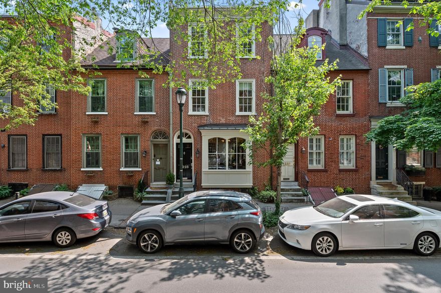 Welcome home to 1228 Pine St, where historic charm meets modern practicality in this tastefully updated  4-bedroom, 3.5-bathroom single family townhome.   Nestled in highly sought after Washington Square West, the residence spans approximately 3200 square feet across three stories & a partially finished basement; this fabulous living space is sure to impress! Upon entering, you'll be captivated by the open concept living and dining rooms, ideal for entertaining guests or enjoying quality time with loved ones. The living room showcases a large bay window, bathing the space in natural light, while a cozy gas fireplace adds warmth and ambiance to the room. Step into the updated kitchen, equipped with granite counter tops,  stainless steel appliances, a built-in water filtration system and radiant heated flooring. From here, access the back deck featuring Trex wood decking and a gated yard, adorned with Astroturf perfect for both children and pets to play. Just beyond the yard, discover a private driveway accommodating two car parking. The first level is complete with a powder room. Ascend to the second level, where you'll find an oversized bedroom, thoughtfully designed with ample workspace and an attached balcony. Travel down the hallway to find an additional bedroom and full bathroom complete with radiant heated flooring. The third floor is dedicated to the primary bedroom, a luxurious retreat featuring a walk-in closet and en suite bathroom with radiant heated flooring, double vanity & jacuzzi tub. The primary suite is complete with a  private balcony, offering a serene spot to enjoy morning coffee or unwind at the end of the day. Indulge in privacy and tranquility as you relax and recharge in this exceptional space! Additionally on this level, you'll find the 4th bedroom. Descend to the partially finished basement, offering even more living space. The heated flooring creates a cozy atmosphere, while a full bathroom adds convenience and functionality to this lower level. Beyond the living space, find an over-sized utility/laundry room with egress to the backyard.  1228 Pine combines elegance, modern amenities, and ample space to create the perfect blend of comfort and style. Don't miss the opportunity to own this exceptional property in one of the city's most desirable locations. Schedule a viewing today and experience the allure of this remarkable home!