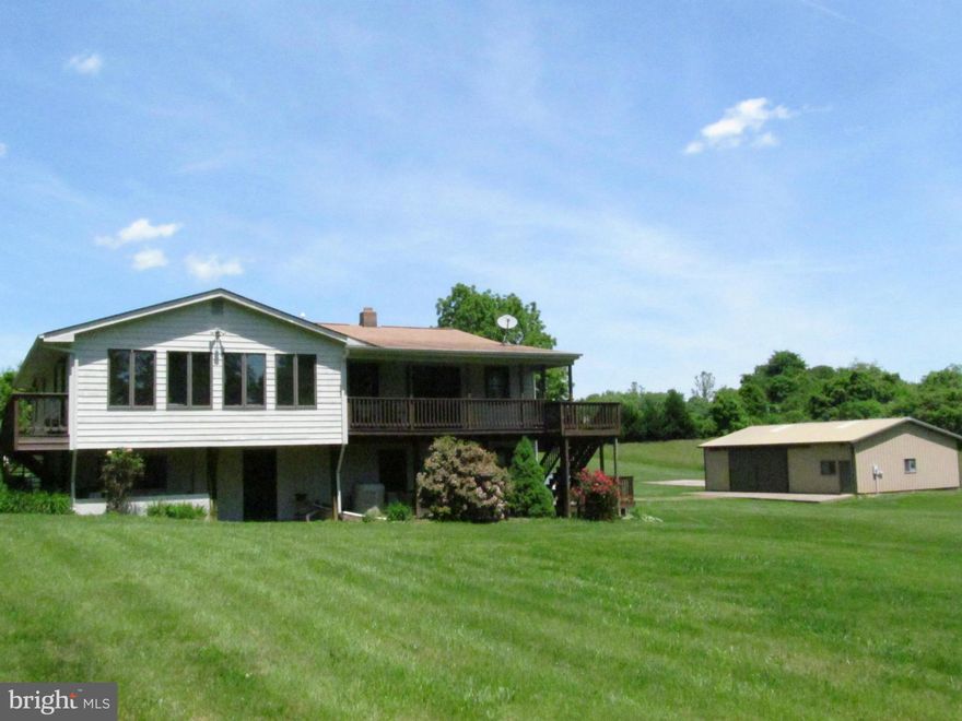 Beautiful  open lot with almost 5 acres.  Remodeled contemporary home with granite counter tops, wood floors, updated windows, freshly painted, 2 finished levels, sun room off kitchen,  awesome decks for enjoying the outside or entertaining.  Huge 45x36 shop with electric which would park 8+ cars! Possible horse property with fencing. Private yet convenient- don't miss this one!