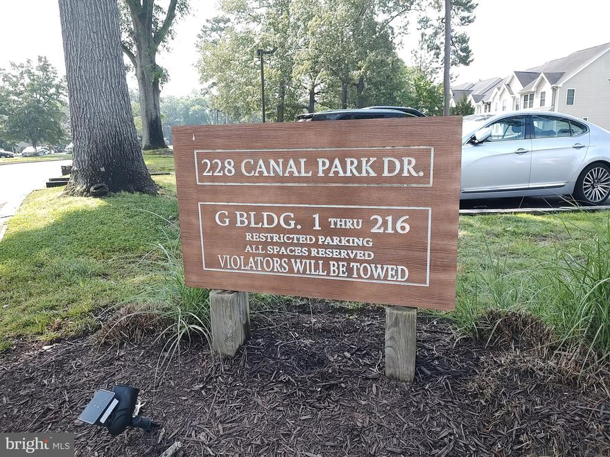 Well maintained 2 bed 2 & 1/2  bath 2nd floor condo in Canal Woods that has a balcony overlooking the pond. Nice tranquil setting to sit outside and enjoy the peace and quiet. Shopping and restaurants within a mile of the community. Ocean City and Assateague Island are within a thirty minute drive. Condo has vinyl plank flooring throughout.  Views of the pond from the LR and master bedroom. Other amenities include a washer/dryer, outside storage locker on the balcony and assigned parking spaces. So come out and take a look at this nice condo that is priced right for a quick sale! Property is being sold as-is!