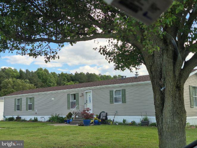 This single wide mobile home on corner lot and cul-d-esac has been well maintained and awaits your immediate occupancy. Upgrades include: Architectural roof (2024), New insulation under home (2024), new propane gas range & range hood, two storm doors and recently painted. Center island offers plenty of room for entertaining.
Primary bedroom with private soaking bath tub/shower plus large walk-in closet are on one end with the other two bedrooms and secondary bath for guests on the opposite end. Rear deck leads to an storage build approximately 10x20 and nice size rear lot. Front patio 10x20 +/- plus cement parking spaces for multiple vehicles. Privately owned Hebron Woods community with monthly Lot rent of $500.00 includes and on duty office manager, your road maintenance, trash, water & septic. Limit of (2) Two dogs not over 30lbs.
Enjoy scenic strolls around the park includes a catch and release pond, community dock and gatherings under the pavilion on the greens. Downsizing or retiring come and enjoy the relaxed Eastern Shore.
Local golf courses, boat launching on the Wicomico or Nanticoke Rivers. Best of all, close to Ocean City, the National Parks of Assateaque & Chincoteaque beaches (Home of wild ponies). Wallops Fight facility and Delaware beaches nearby.