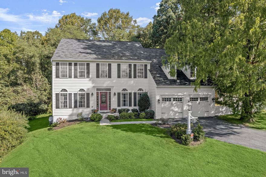 Welcome to 6106 Trotter Ridge Court, this beautiful colonial home gracefully positioned on a premium corner lot on a cul-de-sac street, offers both space and privacy in the sought-after Trotter Ridge community of Columbia with no CPRA. This exceptional home boasts over 4,000 square feet of living space, spread across three impeccably finished levels, providing ample room for comfortable living and entertaining. This unforgettable property offers sophisticated moldings, lofty windows, soaring ceilings, hardwood flooring, upgraded lighting fixtures, generous room sizes, design-inspired finishes, and so much more. The two story foyer is a wonderful welcome to this elegant home with sidelights and wainscoting. Anchored by the foyer is the lovely formal living room graced by intricate crown molding. Opposite the formal living room you are invited into the formal dining room, a perfect entertaining area well-suited for celebratory meals. The kitchen is well-appointed with quartz counters, stylish white cabinetry, pantry, central island with breakfast bar, and stainless steel appliances. The kitchen also provides table space for quick and casual dining. An atrium door off the breakfast room opens to the sizable deck, an ideal spot for al fresco dining or simply enjoying the serene surroundings backing to trees. The heart of this home features a dramatic and welcoming family room with a soaring two-story ceiling that creates an expansive and open atmosphere. Stacked windows flood the space with natural light, and a cozy fireplace creates a warm and inviting focal point. Discover the convenience of a main-level bedroom and a full bath, making it an ideal space for guests or a versatile option for multi-generational living. The substantial upper level is an exciting collection of 4 bedrooms, and 2 full baths. The spacious primary bedroom offers a walk-in closet and second closet to make sure your storage needs are met. The en-suite bath is a design-inspired oasis, complete with a double vanity that adds a touch of luxury, a relaxing soaking tub, and a separate shower. The 3 additional bedrooms are equally impressive and share a full hall bath. The sprawling lower level is quite accommodating, boasting a welcoming recreation room complete with a stone-accented gas fireplace that adds warmth and character to the space. Adjacent to the family room, you'll find a convenient wet bar equipped with a mini fridge, perfect for entertaining. For added flexibility, there's a bonus room with luxury vinyl plank flooring that can utilized as a home office, exercise room, or a game room. Additionally, this home offers a dedicated theater room, providing the ultimate cinematic experience with a projector and screen. Outside, you'll appreciate the serene, wooded view, providing a natural and peaceful backdrop for your daily life with a stone storage shed, and a stone privacy wall, ensuring both functionality and aesthetic appeal. Ideal location convenient to commuter routes, schools, walking/jogging paths, shopping, dining, and entertainment options. Property Updates: Upper level hardwood floors, heating equipment replaced, A/C units replaced, lower level luxury vinyl plank floors, kitchen appliances, washer/dryer, primary bath upgrades, kitchen updates, stair carpet, and more!