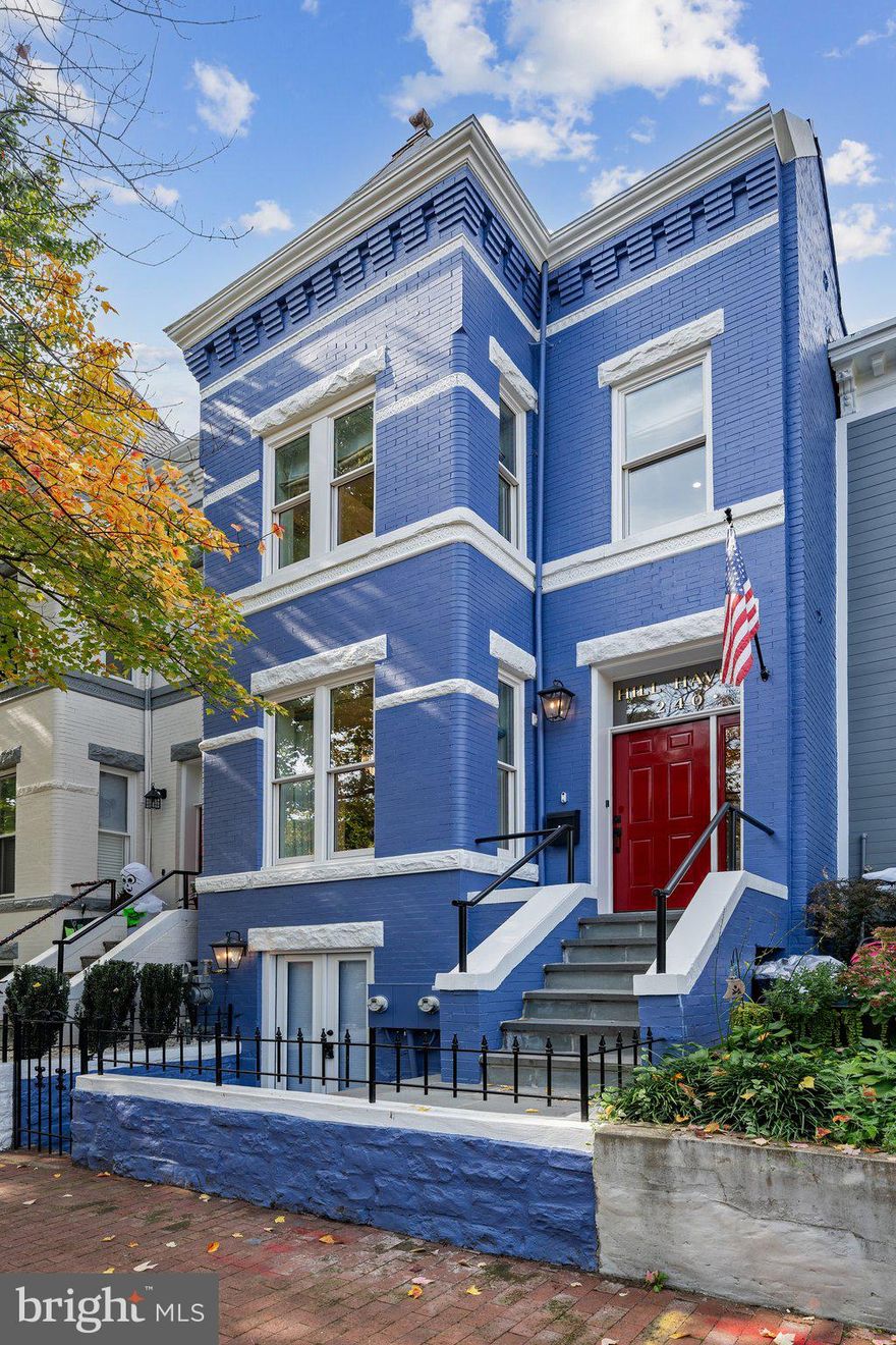 Welcome to 10th Street!
This absolutely stunning 3-bedroom, 2.5-bath townhome in the heart of Capitol Hill effortlessly blends classic charm with modern elegance.

Step inside to tall ceilings, a striking white exposed brick wall, recessed lighting, and beautiful herringbone wood floors. The open-concept living space is anchored by a classic fireplace with a white mantel, creating a warm and inviting centerpiece. Adjacent to the living room is a fabulous dining area that comfortably seats up to ten—perfect for entertaining—illuminated by a show-stopping chandelier.

The chef-inspired kitchen features marble-style quartz countertops, crisp white cabinetry, herringbone backsplash, steel appliances, a wine cooler, and elegant gold finishes. A half bath on the main level adds extra convenience.

Upstairs, the primary suite offers soaring ceilings, a cozy seating area, abundant natural light, custom built-ins, two large closets, and a luxurious en-suite bath. The all-white en-suite includes double vanities, gold fixtures, and a full walk-in shower with timeless tile work. Two additional bedrooms offer generous closet space and access to a private second-story deck.

The backyard is fully hardscaped with custom brick for low-maintenance outdoor living—ideal for gatherings—and is enclosed with a full privacy fence.

Parking: Private 1-car carport parking located in the rear.