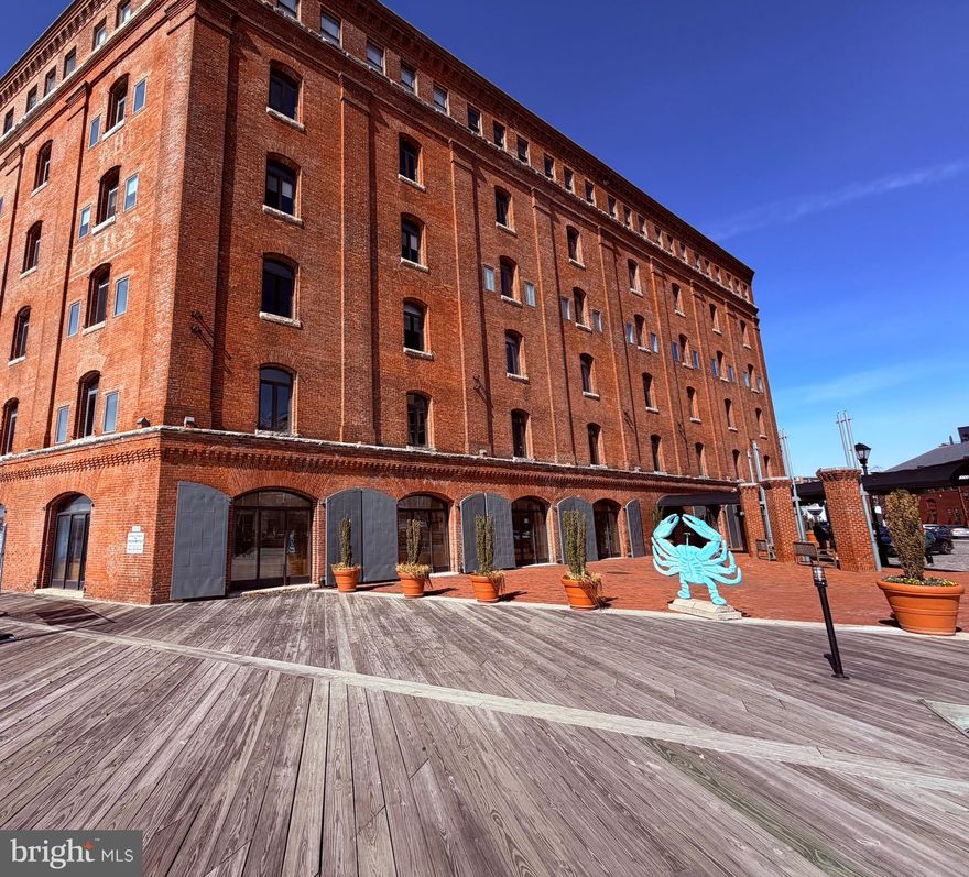 Location. Lifestyle. Waterfront Living.

Welcome home to this charming two-story condominium in the heart of Historic Fells Point, ideally situated along Baltimore’s waterfront. Located within the iconic Inn at Henderson’s Wharf, this unique residence blends historic character with the comfort and convenience of upscale, hotel-style amenities.

Overlooking a beautifully landscaped private courtyard, this former tobacco warehouse offers a peaceful harbor-side retreat while placing you just steps from one of Baltimore’s most vibrant neighborhoods.

This inviting 1-bedroom, 1-bath condo features a distinctive two-story, loft-style layout that adds character and charm to the living space. Residents enjoy access to desirable amenities, including a fitness center, a beautifully maintained courtyard, secure garage parking, and the ease of everyday living that feels like a staycation.

Step outside and you’re moments from the Waterfront Promenade, an 8-mile brick walkway along the harbor, perfect for morning jogs, dog walks, or relaxing waterfront strolls. The location is also convenient to Johns Hopkins Hospital and Medical School, making it an excellent option for those seeking both lifestyle and accessibility.

Fells Point’s acclaimed restaurants, shops, and nightlife are right outside your door, allowing you to enjoy the neighborhood to the fullest without ever needing a ride home. For the times you do want to drive, the home includes a deeded parking space, a rare and valuable feature in this historic waterfront community.

Charm, convenience, and waterfront living—this is truly the perfect place to call home.