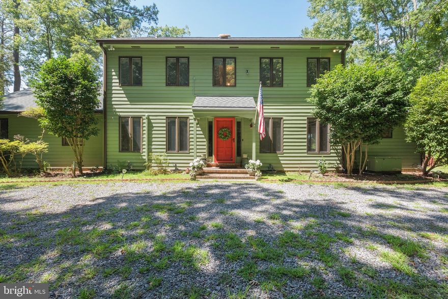 Affectionately referred to as Critter Crossing Cottage, this custom waterfront home is impeccably appointed and beautifully sited on over 13 private acres. Inside the welcoming foyer, you are greeted by hardwood floors throughout the first floor (travertine heated marble in kitchen!). The gourmet chef's kitchen boasts Wolfe stack appliances, gas cooking, a wine fridge, an island and much more. The private laundry room includes cabinets and granite countertops. A sitting room off the kitchen is warmed by a woodstove. The family and dining areas are spacious, offer amazing views past the stone sitting porch. On the second floor you will find a beautifully appointed primary suite with a luxurious bath, walk-in closets and private balcony. Two additional bedrooms are spacious, sharing a jack and jill bath which is beautifully designed. The third floor offers media and/or family space and another private bedroom! There is great covered outdoor space for entertaining or relaxing, a fenced backyard and a welcoming dock overlooking Oyster Creek and the Rappahannock! The views are mesmerizing! A spacious two-car garage completes the picture. Shopping, entertainment & restaurants nearby.