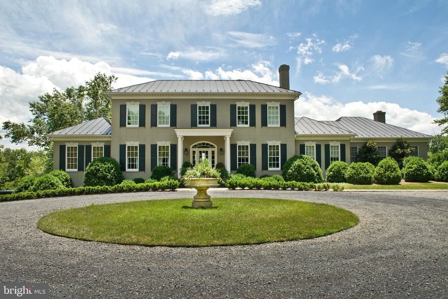 Welcome to Waverly Hill, an elegant Middleburg country estate beautifully situated on 20+ private acres with Goose Creek frontage and mountain views. Custom built in 2002 by University Homes, this Georgian estate offers 8,000+ finished square feet on three levels including 4 bedrooms, 5 full bathrooms, 1 half bathroom, and a 2 car attached garage. The spacious, bright, and airy interior boasts well-appointed finishes, stunning architectural detail, and a thoughtfully designed floor plan perfect for entertaining. The special features include wide ash board floors on the main and upper level, custom built-ins, wainscotting, deep moldings, an eat-in gourmet kitchen, a formal dining room, and a formal sitting room. Relax and unwind in the beautifully designed main floor primary suite with a walk-in closet and a luxury bath with double vanities, a soaking tub, and a standing shower. The upper level offers three bedrooms with en-suite bathrooms. The stately back porch with panoramic views of the mountains and multi-level garden is ideal for your next gathering! Located in Middleburg Hunt territory.