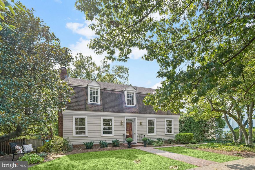 Welcome home to a quintessential Williamsburg Colonial, offering more than 3,000 square feet of living area across three generously proportioned levels in coveted Chevy Chase Village. With sunny, grandly scaled rooms, newly refinished wide-plank hardwood floors, oversized windows, French doors, bay windows, and cozy wood-burning fireplaces, this home radiates charm and character at every turn.

The main level features a welcoming foyer and entry hall that sets the stage for elegant entertaining. A formal dining room and living room with fireplace are complemented by a light-filled family room with floor-to-ceiling windows on two sides. At the heart of the home is the eat-in kitchen with its own brick fireplace, framed by custom built-ins and a cheerful bay window complete with a wide window seat. The kitchen showcases white cabinetry, subway tile backsplash, quartzite countertops, a six-burner Thermador gas range, KitchenAid appliances, and abundant storage — the perfect blend of style and function. A powder room and oversized coat closet complete this level.

Upstairs, you’ll find four well-appointed, light-filled bedrooms, including a serene primary suite with large windows, two closets, built-in shelving and desk, and a spa-like en suite bath with a walk-in shower, bench, double vanity, and stylish tile. Three additional bedrooms (all with hardwood floors) share a recently updated hall bath with bathtub.

The lower level offers a flexible recreation room, substantial storage, laundry, and another half bath, plus a separate rear entrance with easy access to the driveway. Outside, the front yard comes alive each spring with cherry and magnolia blossoms, while the fenced backyard features blooming hydrangeas and a graceful dogwood tree. A detached one-car garage adds both convenience and charm.

Recent Upgrades -  new hot water heater, A/C, Bosch dishwasher, washing machine, and those gleaming refinished floors — mean this home is truly move-in ready.

Living in Chevy Chase Village comes with unmatched perks: 24-hour police service, lively community events, walkability to Broad Branch Market, two farmers’ markets, and local schools — plus twice-weekly trash collection right at your house (no dragging bins to the curb!).

4 bedrooms. 2 full baths. 2 half baths. Endless charm. Fantastic backyard. Fabulous location. 
This is THE ONE you’ve been waiting for. Open Saturday & Sunday!