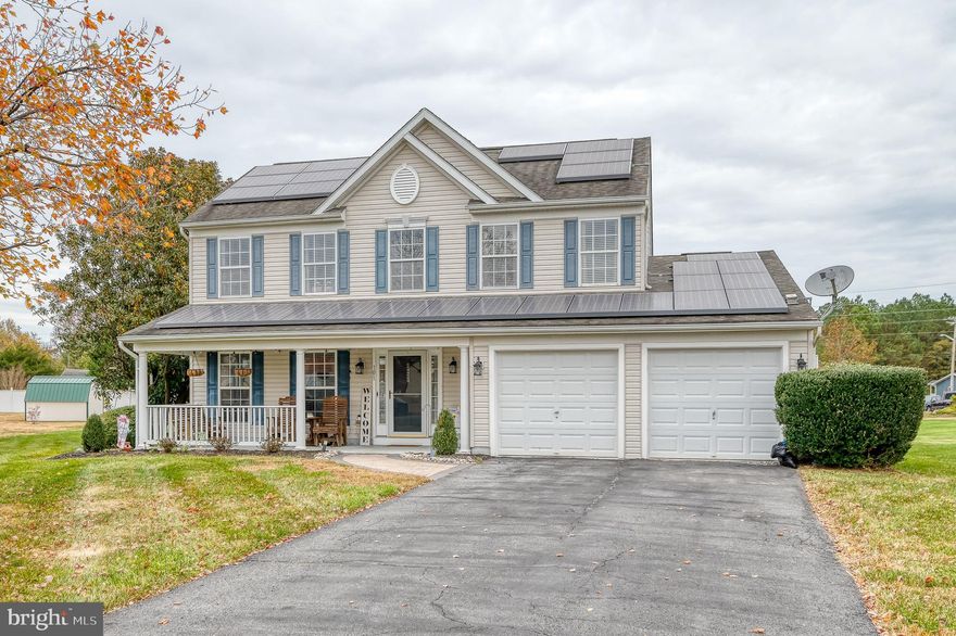 Welcome to this move-in ready 3BR/2.5BA Colonial style home, set on a pristinely maintained lot in the desirable Woodsedge neighborhood.  Pull into the double-wide driveway, park in front of the two-car garage, and head up to the inviting covered front porch.  Step inside to a two-story foyer filled with natural light and a view of the second-floor landing.  New luxury vinyl plank flooring extends through the hallway, half bath, main floor laundry, and the spacious dining room.  Continue into a bright and open family room with a vaulted ceiling, which flows seamlessly into the breakfast room and kitchen.  The kitchen offers plenty of cabinet and counter space, including a coffee station, a large pantry closet, and newer stainless steel appliances.  Off the breakfast room, you’ll find a spacious sunroom with floor-to-ceiling windows that open to let in a cool evening breeze.  The main floor includes a generous owner’s suite with a large walk-in closet and a private ensuite bath featuring a double sink vanity.  Upstairs, two additional primary-sized bedrooms each offer large closets and share a full bath.  Outside, the newly installed paver patio overlooks a beautiful yard with an abundance of green space, a storage shed, and a playset.  This home is filled with modern amenities, including solar panels and a 12-zone irrigation system.  All this, plus close proximity to shopping, dining, and commuter routes—imagine the possibilities!