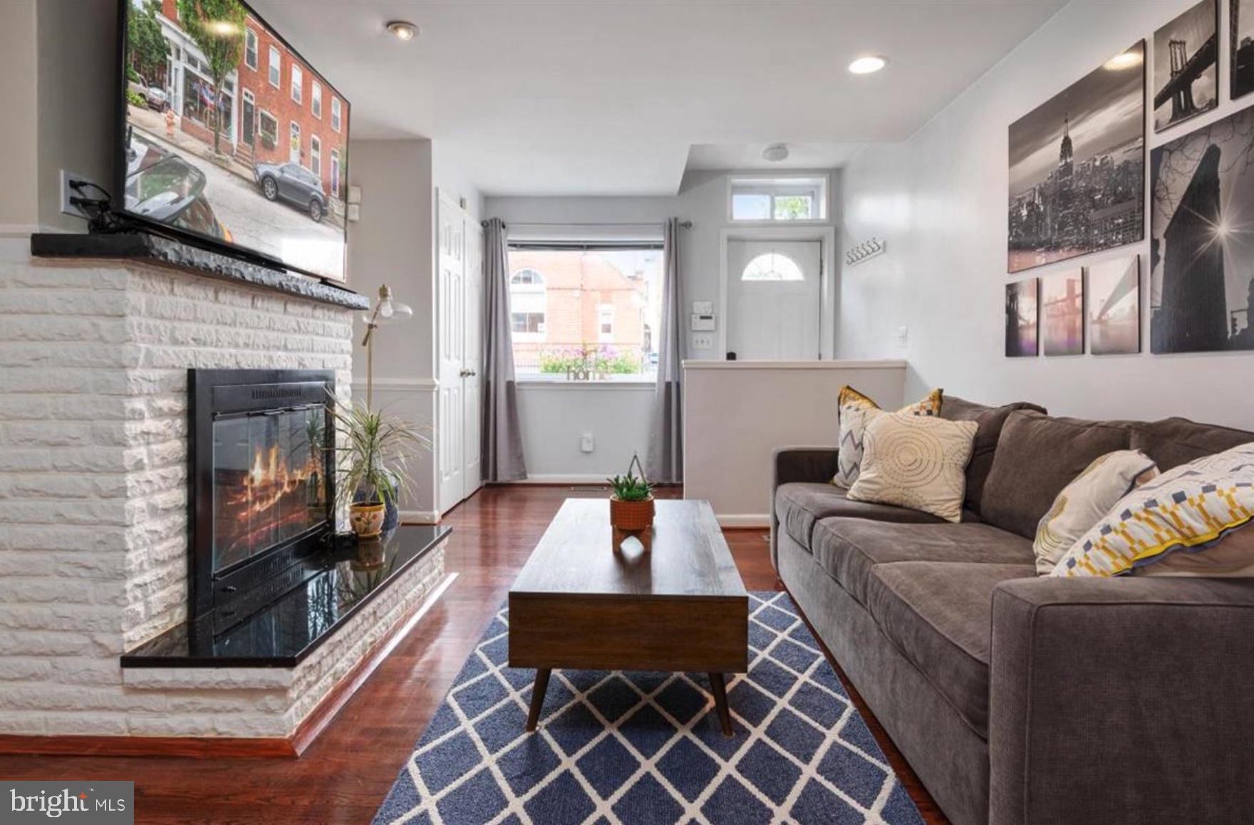 FURNISHED OPTION Preferred- This townhome located right on the end of O'Donnell Square has it all with prime location, upscale finishes, and 3 bedrooms with 3 full bathrooms. Enter through the front door into the living room which is an open floor plan to the dining room and kitchen. The wainscoting and fireplace on this level bring an upscale vibe to cozy living. There is a room off of the back of the kitchen that could be used as an office or breakfast nook along with a patio for bistro style dining or relaxing in nature; you set the vibe. The basement can be used as a bedroom since it has a locking door or can be used as a bonus room. There is a full bathroom in the basement along with many large storage closets. The second level has 2 very large bedrooms. One of the bedrooms has an en-suite full bathroom with double sinks and the other bedroom is large with the full bathroom located right next to it with hall access. This home is a 3 minute drive to the Harris Teeter and Target shopping center and is a 5 minute walk away from Canton Water Front trail. Also, as previously mentioned this home sits right at the top of O'Donnell Square just steps away from restaurant and bar dining and nightlife.