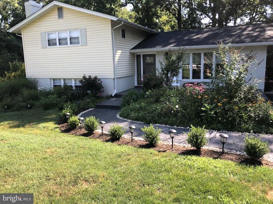 Gorgeous country like setting for this expanded and updated contemporary 4 bedroom home! Updates include: cherry cabinetry, stainless appliances, granite counters, recessed lighting, updated bathrooms, front load washer and dryer, 2 car carport, and beautiful landscaping. You will feel like you're in the country yet your minutes from Fort Belvoir, Old Town Alexandria and a short commute to Pentagon.