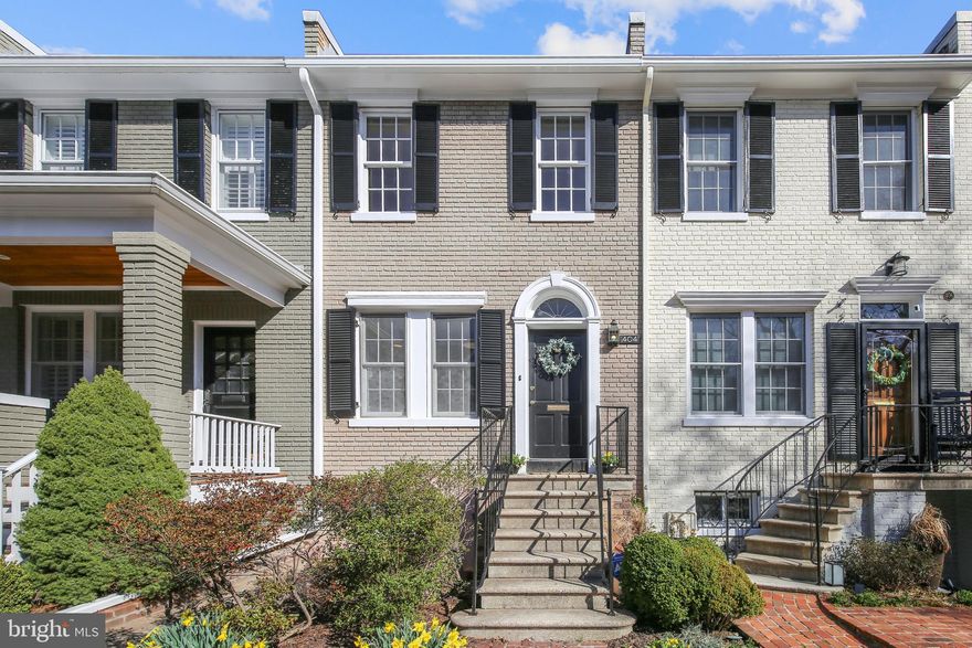 LOCATION AND CHARM! Four blocks off King Street, this sundrenched two or three bedroom home with off-street parking will answer your dreams. The renovated kitchen fows into the adjacent dining area appointed with crown molding and chair rail. The living room is centered on the freplace surrounded by double French doors leading to the deck and the fully fenced backyard and patio. Gleaming hardwood foors are found throughout the main and second levels. On the upper level, the spacious primary
bedroom is warmed by a freplace and boasts two large closets. This bathroom was renovated in 2022. The second bedroom is not only graciously sized but also includes two closets and original fooring. From the main level, go down the stairs and enter the family room/third bedroom with the third freplace, recessed lighting, built-in bookshelves and French doors leading to the lower patio. The second bath was recently renovated with updated tile, vanity and lighting fxtures. A brand-new washer and dryer will be delivered soon. The separate private entrance to the lower level offers the opportunity for a guest suite. Old Town is easily accessible to the George Washington Parkway and the I-95 corridor including the Beltway making commuting to Washington DC, Maryland and Virginia easy. A free trolley runs up and down King Street corridor to the Metro. Enjoy the many human and dog parks, restaurants and bars and fabulous retail stores - all within minutes of this home. Safeway, Harris Teeter,
Trader Joe's, Whole Foods and soon Wegmans are nearby.  CONTRACT DEADLINE IS NOON MONDAY.