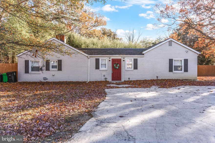 This spacious house is perfect for your family, featuring a total of four bedrooms and two full bathrooms. It boasts beautiful hardwood floors, with carpeting in the cozy bedrooms. The kitchen is newer, equipped with granite countertops and high-end stainless steel appliances. There's a separate dining room that offers outdoor access to a private porch, along with a fully fenced yard—ideal for family barbecues and relaxation.  The carpet in the home is new. The driveway can easily accommodate 4 cars. Schedule your appointment today to make this home yours!