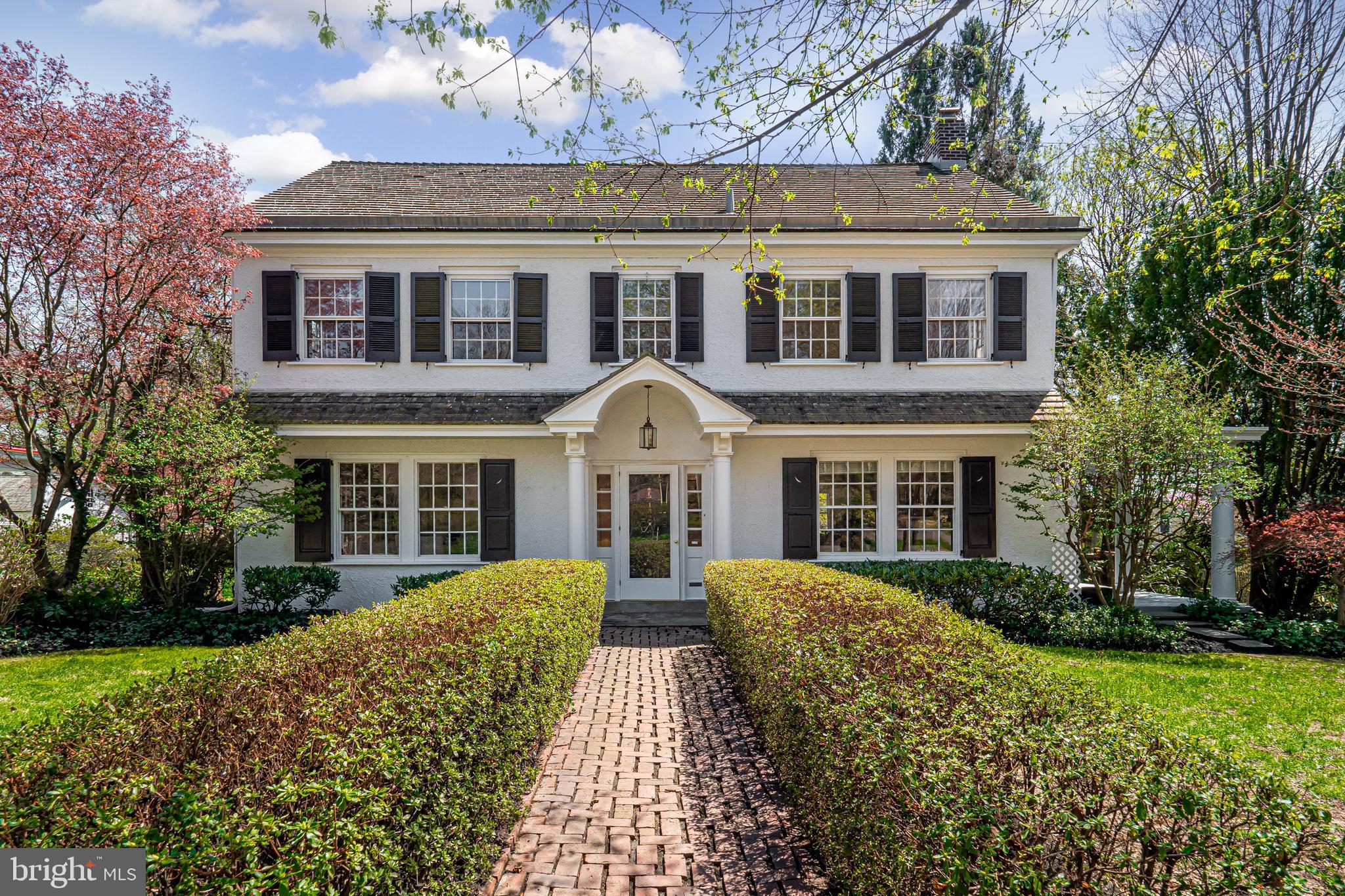 In West Chester Borough, there are a handful of iconic properties that everyone knows. 132 W Virginia Avenue is one of those homes. Enter into the foyer which flows straight through to a glass door to the backyard. To the right is a spacious living room with fireplace, access to a flex room which could be an ideal study or sunroom, and to a quaint outdoor covered porch. To the left of the center hall is the dining room with corner cabinet built-ins. Access the kitchen through the butler's pantry, complete with classic cupboards and a working sink. The modern kitchen with a built-in Sub-zero refrigerator and luxury Dacor appliances including double ovens offers a workable space with plenty of storage. Step down into the family room with fireplace, built-ins, and large windows to enjoy the views of the private backyard. A rear staircase and powder room complete the main floor. Upstairs is a master suite with a stylish full bath and grand walk-in closet with organizers. Two other bedrooms and an updated hall bath complete this level. On the third floor is a private suite with another walk-in closet and full bath. A finished basement adds to the living space of this already spacious home complete with a wet bar and beverage center. The inside of this home is enough to make you fall in love but once you see the backyard, you will realize why this is such a special and unique home. Outside, there are multiple levels to entertain and enjoy - highlighted by a fire pit, a koi pond with waterfall and specimen plantings. A 2-car garage with a brand-new roof completes this property. 132 W Virginia Avenue is truly an oasis within walking distance to West Chester Golf and Country Club, and all of the restaurants and festivities of the Borough.