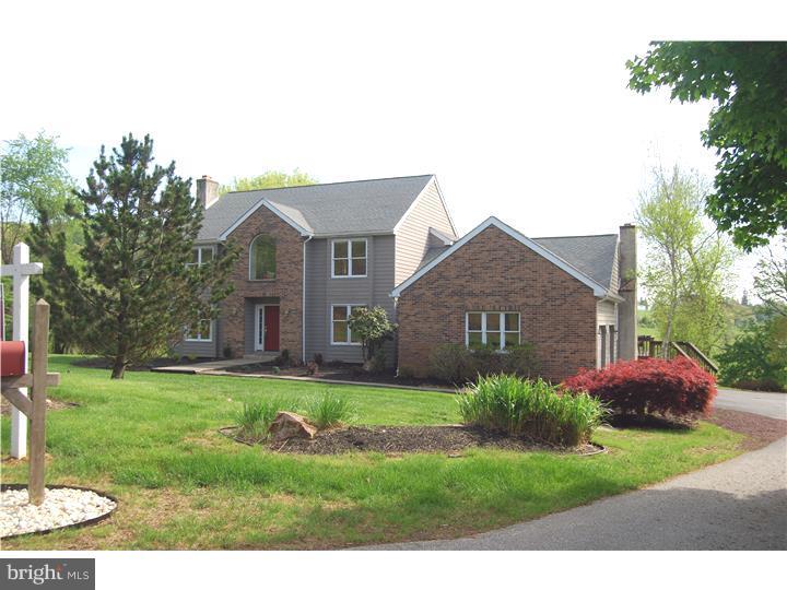 SPECTACULAR UNOBSTRUCTED CHESTER COUNTY VIEWS of Pocopson Park! This well maintained property is situated in a prime location with gorgeous picture perfect views of hills in the distance and a stream in the valley which may be enjoyed from large windows in the kitchen and family room or relaxing in privacy on the large deck. The property, located at the end of a cul-de-sac and has been professionally landscaped. Upon entering the home there is a beautiful open staircase from the entrance hall that leads up to the second floor landing with a hugh palladium window that lets in tons on natural light. There are beautiful wood floors throughout the home. The first floor consists of an Entrance Hall, Living Room with beautiful brick fireplace, Dining Room, Eat-In Kitchen with granite counter tops and new stainless steel appliances, Family Room with another brick fireplace, Office, Laundry Room and a Half Bath. The Master Bedroom Suite, 3 additional bedrooms, and a full bathroom are located on the second floor. There is a large sliding glass door that leads to a covered patio on the lower level. For additional heating options, there are 2 locations available to install coal or wood burning stoves. Don't miss this unique one of a kind opportunity!