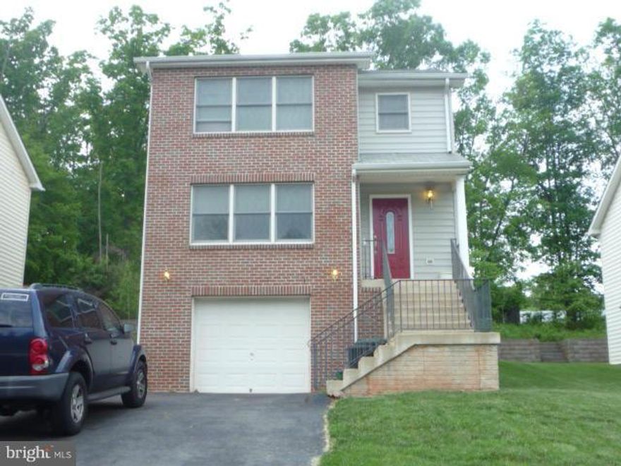 Cute home needs a little TLC - Property has been aggressively priced based on minor improvements that need to be done - Neutral Carpet in Living Room & Dining Room - Hardwood Floors in Foyer/Hall & Kitchen- Maple Cabinets- Porcelain Sink-Smooth Top Range-Family Room off Kitchen area with door out to rear yard- Lower level Has Rec Room (currently a Man Cave) & Full Bath