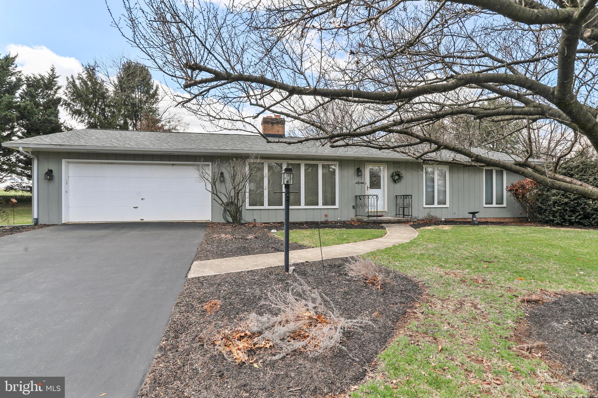 Welcome to this delightful 3-bedroom 2-bath rancher, perfectly situated on a spacious 0.46-acre corner lot! Featuring 1,421 sq.ft. of living space. As you step inside, you're greeted by beautiful hardwood flooring that flows throughout the home. The spacious living room is centered around a cozy wood-burning fireplace, perfect for relaxing evenings. The eat-in kitchen features white cabinetry, vinyl flooring, and all appliances, making it a functional and inviting space for meal prep and family gatherings. The primary bedroom offers a private en-suite with a walk-in shower. Two additional bedrooms share an updated hallway bathroom, which was updated just two years ago. A convenient laundry closet adds to the home's practical layout. Whether it's a sunny morning or a cool evening, the bright and airy 3-season room connects you to the outdoors in comfort. Brand new roof installed in 2024, peace of mind for years to come. The sizable lot gives you plenty of room to enjoy the outdoors, whether you're gardening, entertaining, or simply unwinding. This home offers a serene atmosphere, while still being conveniently close to local amenities. Don't miss the opportunity to call this your new home!