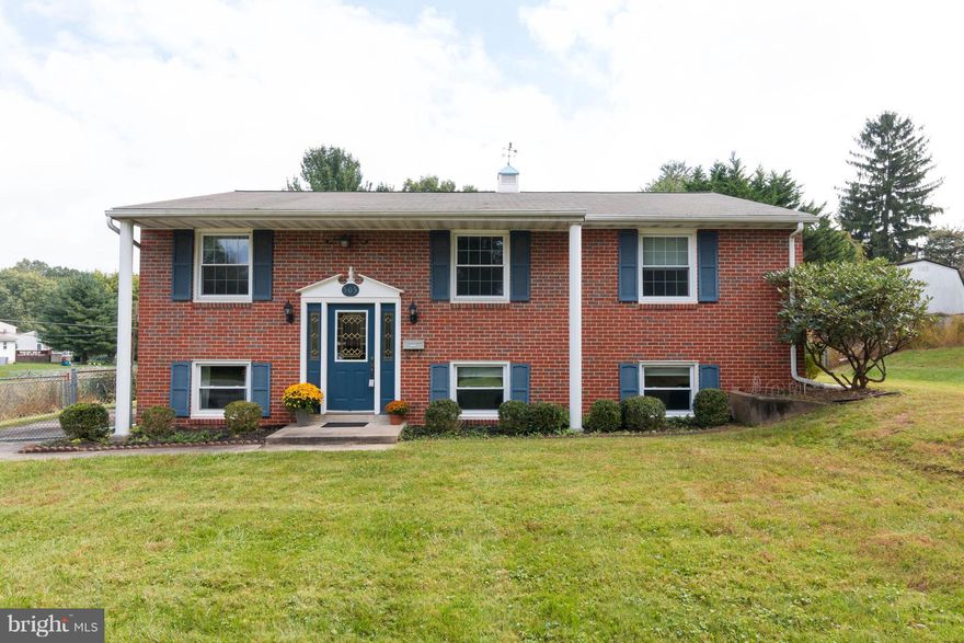 PRICED TO SELL AND MOVE IN READY charming 3 BR split foyer home.  Corner lot with large, fenced back yard.  Fresh paint throughout and hardwood floors in all bedrooms, living and dining rooms. Kitchen with granite counter tops, partially finished basement/rec room with room for storage. Kitchen access to deck.  Driveway with fenced parking pad. Close to schools & shopping.