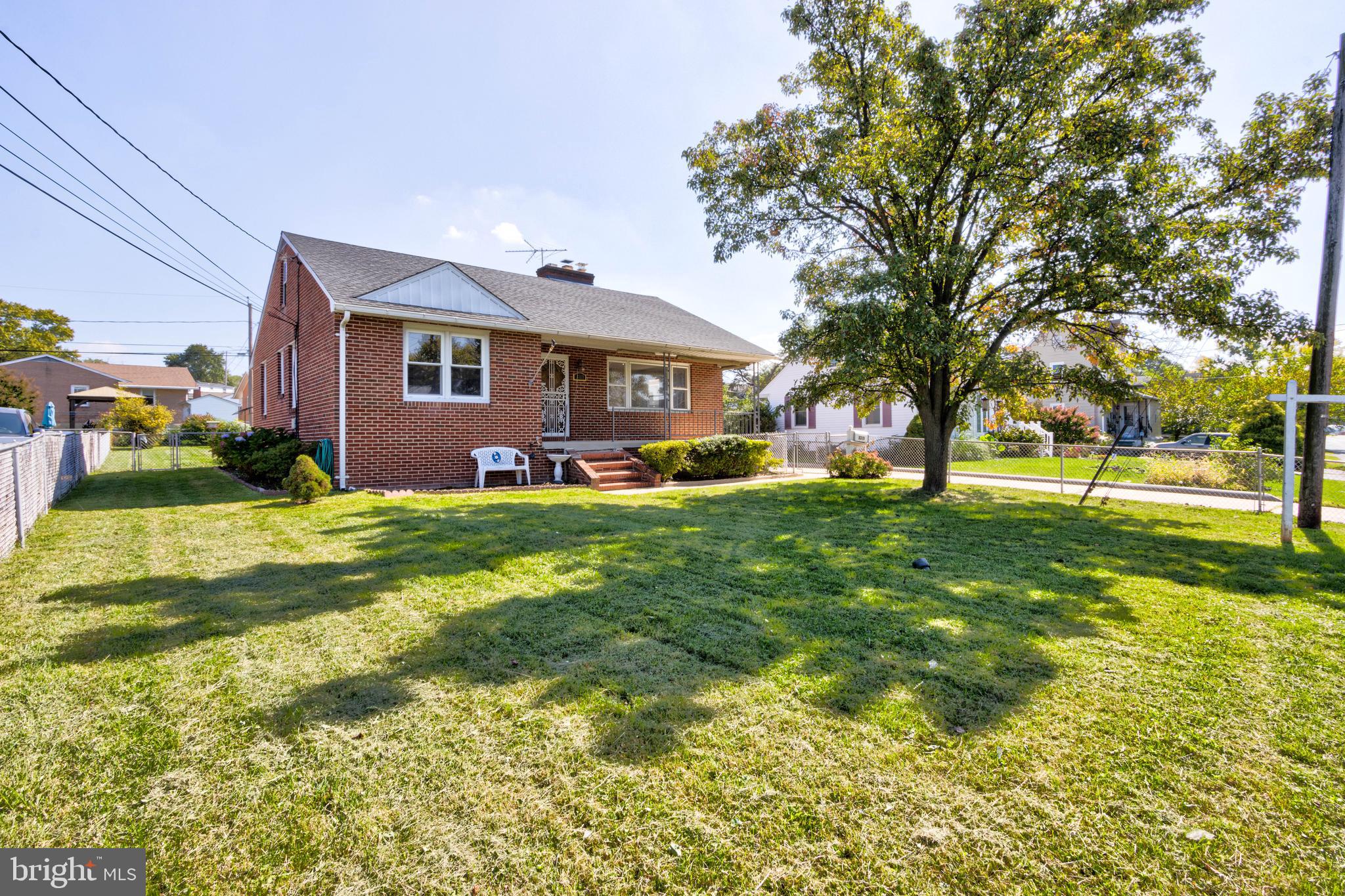 Welcome, home! Beautiful brick cape cod home in Parkville! Gorgeous kitchen, with new stainless steel appliances, quartz countertops, and perfectly matched tile backsplash. Refinished hardwood flooring through the main level. Oversized living room has a wood-burning, brick fireplace and a large bay window. Tons of natural light! Lower level family room has new carpet, brick fireplace, and a wet bar, an excellent space for gatherings. New architectural shingle roof and HVAC system. Parking is no issue with your 4-car driveway and 2-car detached garage. A huge, fully fenced lot is the perfect space for entertaining. Excellent location, close to shopping, stores, and all major roadways! Schedule your appointment today!
