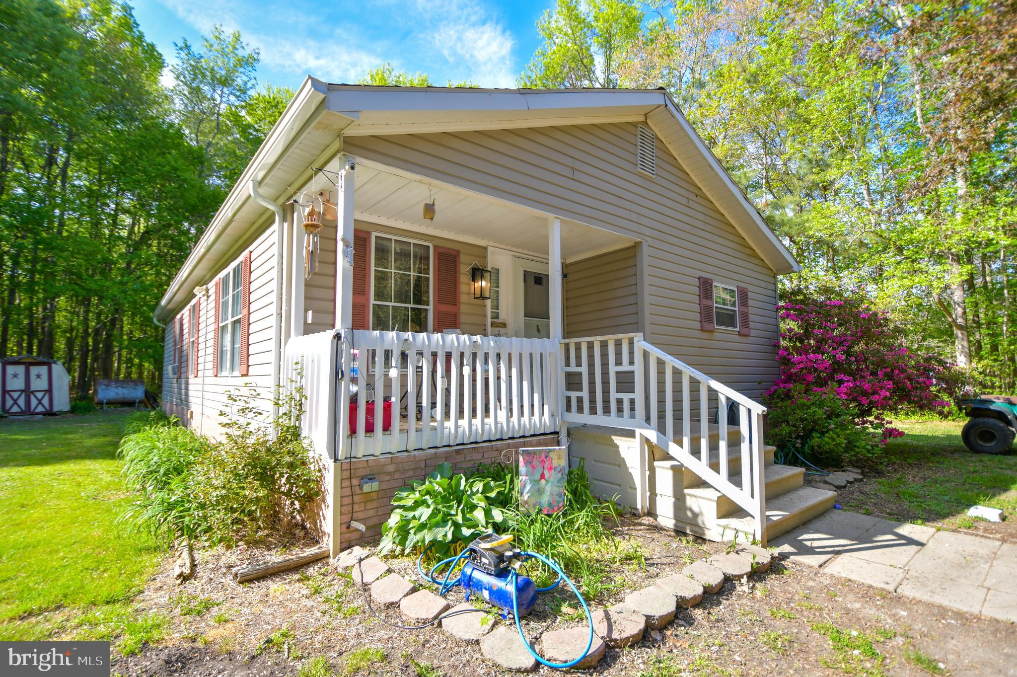 Welcome home to 7080 Charles Cannon Rd in Marion Station MD. This 2 bedroom 2 bathroom home is nestled on 6.18 country acres complete with a cleared area, wooded area, and a pond. Sit on the front porch and enjoy nature around you or stay inside and enjoy the openness of the kitchen and living room area. If you need a 3rd bedroom, the 2nd bedroom can be converted back into a 3rd room by adding a wall and door way. Retreat into the primary bedroom with its private bathroom. If you feel this home is not big enough, there's room to expand or potentially build a new home! This could be the home you've been waiting for!