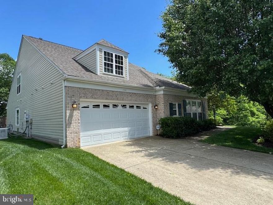 Welcome to the Wedgewood model—rarely available and sitting a beautiful private landscaped culdesac lot backing to the Occoquan River, sitting on the deck for early morning coffee or tea and listening to the rapids of the water and walk over to the wooded area one can see the water flowing by.  Nature and wildlife abound truly a private setting for this lovely home.
Located in the amenity-filled River Ridge 55+ community, this beautifully maintained Pulte-built Wedgewood model offers over 3,400 sq ft of thoughtfully designed main-level living. It is believed there are  only seven of these homes  built in the community, this is a unique opportunity for buyers seeking spacious, low-maintenance comfort in a truly special setting.
Step inside to discover upgraded countertops, a bright and airy sunroom, and an open-concept layout that flows beautifully from the kitchen to the family room—perfect for relaxing or entertaining. The main level also features generously sized bedrooms, including a private primary suite, Stairs and functional chair lift brings you upstairs to a Flex room and open sitting area and private Bath and Bedroom for guests.
Enjoy peaceful mornings on your back deck, or take a stroll through the community’s scenic walking paths. River Ridge residents benefit from a wide range of resort-style amenities, including a clubhouse, pool, tennis courts, fitness center, billards shuffleboard  and regular community events that bring neighbors together. Shopping, dining, and medical facilities are just minutes away—making everyday life both convenient and enjoyable. There is a oversized pond area with scenic deck near by.
This home is move-in ready for its next owner to enjoy all that River Ridge has to offer. Don’t miss your chance to live in one of the most desirable homes in this vibrant active adult community located in Prince William County . Recent appraisal notes 3,444 finished square footage and be sure to look at appraisal in documents Pricing of home significantly below appraisal and seller has made appropriate price adjustments for painting and upgrading and improvements . Did I mention Downtown Historic Occoquan is within 5 minutes to enjoy the shops and dining and all this little town offers. Access to the water is nearby and offers an abundance of things to do. Hospitals, medical, shopping, Potomac Mills Mall nearby .
An absolute private home site  in this sought out community.