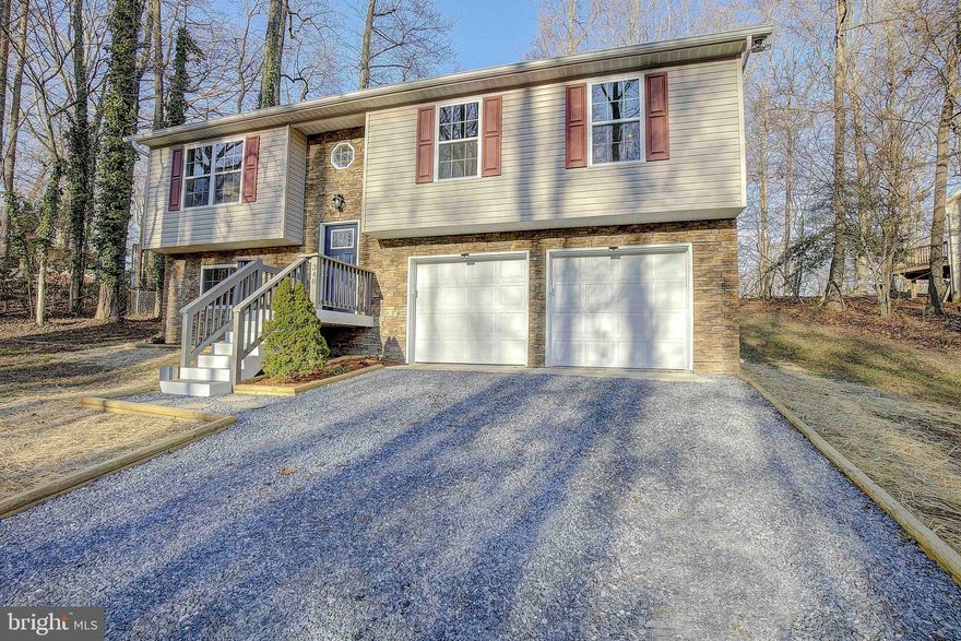 Check out this newly remodeled 4 Bedroom 3 bath Split Foyer- style home! The renovations were just completed in 2022-2023. The home features two master bedrooms with ensuite bathrooms. This home has a newly installed HVAC unit (inside/out units), water heater, light fixtures/fans, windows, exterior doors including the garage doors, flooring (vinyl and carpet), bathrooms, and kitchen. The home is equipment with an inline air purification system ducted into the HVAC. The kitchen is spacious with an eat-in dining room that overlooks the back deck. The kitchen has a garden window, new stainless appliances, soft close cabinets, and waterfall quartzite countertops.

The oversized two car garage has storage shelves and a work bench for enthusiast. You can access the garage from the rear doorway, interior door from within the home, or by using the keypad on the exterior of the garage doors. The belt driven garage openers with battery back-up are new and come with four remotes for easy access. If you need additional storage, there is a shed in the backyard.

This property is in a commuter friendly location for those traveling to Calvert Cliffs, NAS Pax River, and/or Washington, D.C. In addition, this property is located near several local Hospitals including MedStar St. Mary’s Hospital and Calvert Health Medical Center. Enjoy the benefits of being a member of this community with access to sandy beaches overlooking the Chesapeake Bay, a freshwater lake with fish, and clubhouse. Do not miss the opportunity to own a home that features a modern open floor plan with a kitchen, dining room and living room space set for entertaining.

The on-site septic system was recently inspected. The water is provided by Chesapeake Water Association. This property is being sold “as-is” condition. Are you ready to call it Home Sweet Home! Call today to setup a private showing!