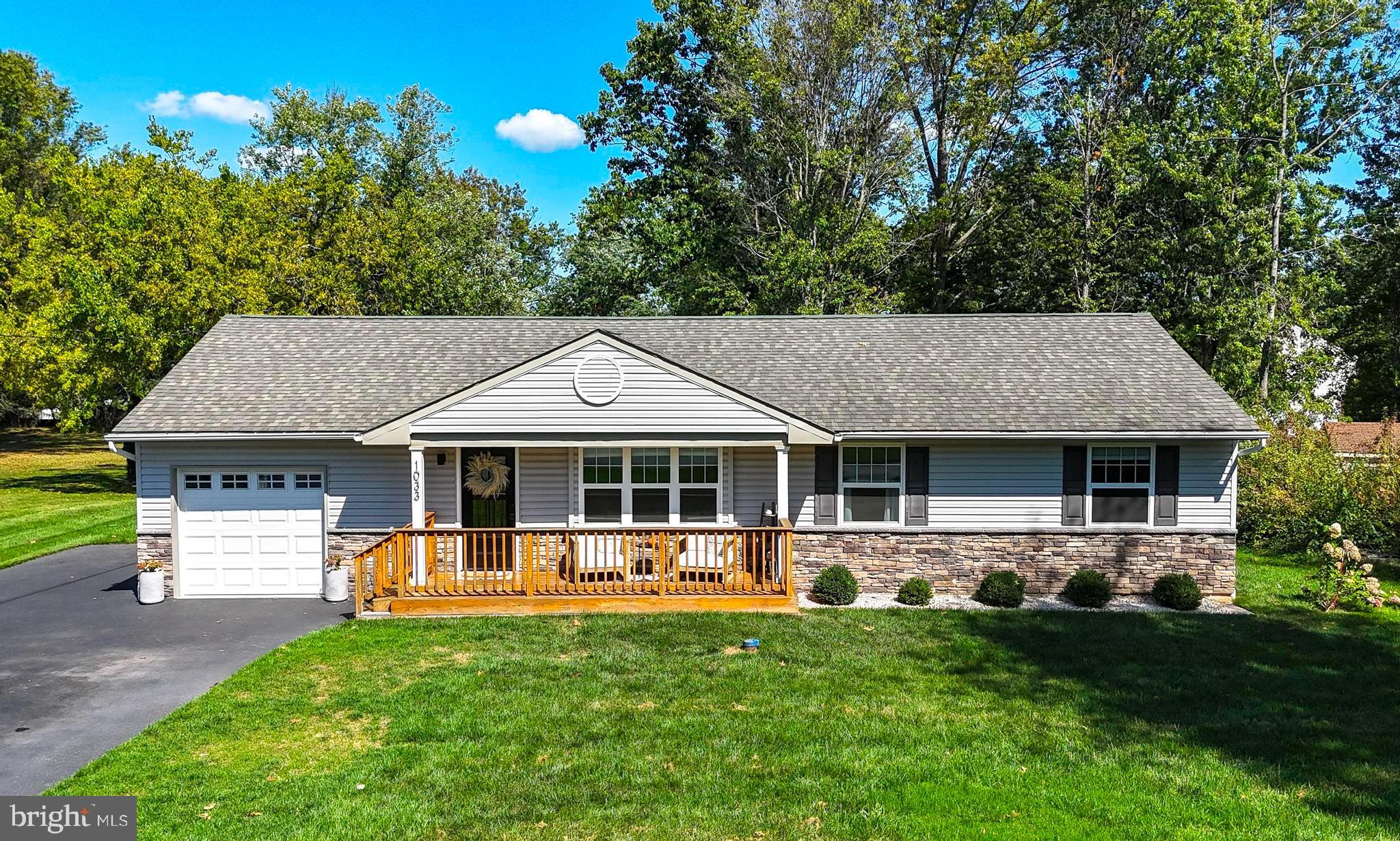 Welcome to this beautifully renovated 3-bedroom, 2.5-bath ranch home nestled on a flat and picturesque 0.8-acre lot in the highly desirable North Penn School District. Completely updated with high-end finishes, this home offers the perfect blend of modern luxury and comfortable living. Step inside to find luxury vinyl plank (LVP) flooring throughout, setting the stage for the designer kitchen featuring crisp white cabinetry, granite countertops, stainless steel appliances, and a stylish tile backsplash. Just off the kitchen and dining area, a cozy sitting room with a painted white stone wood-burning fireplace provides the perfect spot to relax—or use it as a home office. Sliding glass doors lead from this space to a spacious rear deck, ideal for entertaining or enjoying the serene backyard. All three bedrooms are conveniently located on the main floor, including a beautifully appointed primary suite with a walk-in closet and a private en-suite bath. The main-level laundry room adds even more convenience. Additional features include a 1-car attached garage and a full, unfinished basement that has been professionally waterproofed—offering tons of potential for future finishing or abundant storage. Don’t miss this move-in ready gem with modern upgrades, functional layout, and a truly gorgeous lot. Schedule your private showing today!