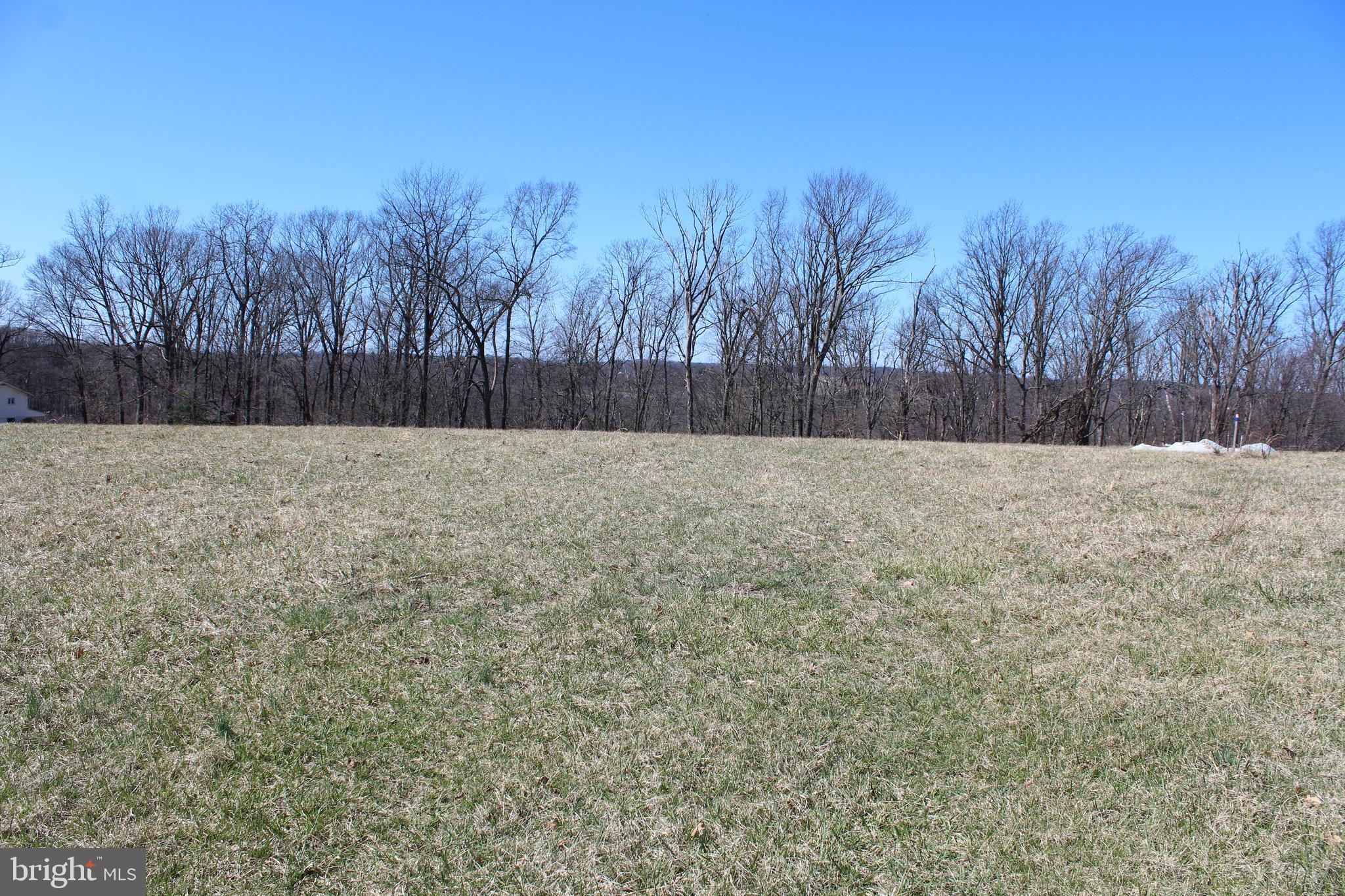 This 2.30-acre lot in the picturesque Carroll County/Manchester area offers a peaceful retreat surrounded by natural beauty. The land is spacious and offers plenty of room for various outdoor activities, with ample space for a home, garden, or additional structures. A well is already on-site, making it an ideal location for someone looking to build or establish a self-sufficient property. The landscape is level to rolling and open areas that capture the essence of country living. Whether you're looking for a quiet getaway or a place to build your dream home, this lot provides the perfect blend of tranquility and convenience. Carroll County's charm and community spirit, combined with this expansive lot, make it an exceptional opportunity for buyers seeking a serene lifestyle. This lot is newly recorded in Manchester known as the "Huber Property". Beautiful 2.30 acre clear lot with included well. Well depth is 500' @ 2.0 GPM. Perc approved for a 4 bedroom sand mound septic system. No covenants, restrictions or HOA. Lot is ready for a building permit application. Additional 2.47 acre adjoining Lot 1 is also available for sale. See MLS#MDCR2026192.