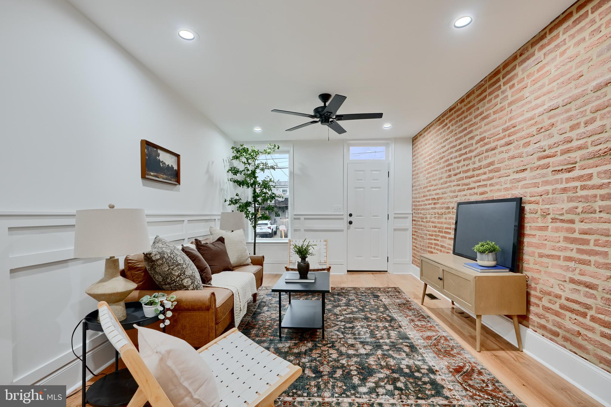 Welcome to this stunning CHAP renovation in Federal Hill, offering the perfect blend of historic charm and modern upgrades. Step inside to find gorgeous trim work, hardwood floors, exposed brick walls, and a bright, open living space. The spacious kitchen is a chef's dream, featuring quartz countertops, Samsung stainless steel appliances and ample cabinet space. Enjoy the elegance of a separate dining space, ideal for entertaining.
Upstairs, the luxurious primary suite boasts two closets and a spa-like ensuite bathroom with a dual vanity. A conveniently located upper-level washer and dryer add everyday ease. The front bedroom showcases more exposed brick and sits just off a beautifully finished hall bath.
The fully finished basement includes two additional bedrooms and a full bath, perfect for guests, a home office, or additional living space. Off-street parking completes this incredible package. And don't miss the expansive trek rooftop deck-accessed by a dedicated interior stairwell-perfect for relaxing or hosting friends.
Just steps from shops, dining and Riverside Park-this home truly has it all! Final chap pending approval.