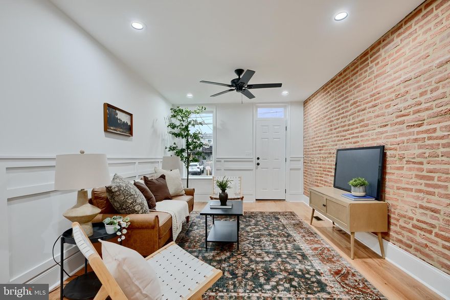 Welcome to this stunning CHAP renovation in Federal Hill, offering the perfect blend of historic charm and modern upgrades.  Step inside to find gorgeous trim work, hardwood floors, exposed brick walls, and a bright, open living space.  The spacious kitchen is a chef's dream, featuring quartz countertops, Samsung stainless steel appliances and ample cabinet space.  Enjoy the elegance of a separate dining space, ideal for entertaining.

Upstairs, the luxurious primary suite boasts two closets and a spa-like ensuite bathroom with a dual vanity.  A conveniently located upper-level washer and dryer add everyday ease.  The front bedroom showcases more exposed brick and sits just off a beautifully finished hall bath.

The fully finished basement includes two additional bedrooms and a full bath, perfect for guests, a home office, or additional living space.  Off-street parking completes this incredible package.   And don't miss the expansive trek rooftop deck-accessed by a dedicated interior stairwell-perfect for relaxing or hosting friends.

Just steps from shops, dining and Riverside Park-this home truly has it all!  Final chap pending approval.